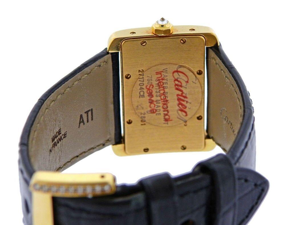 Classic 18k gold Divan watch by Cartier, adorned with approx. 1.50ctw in G/VS diamonds on the bezel. Approximate retail $21400. Comes with box and papers. Ref. WA301071. Cartier black leather band - 7.25