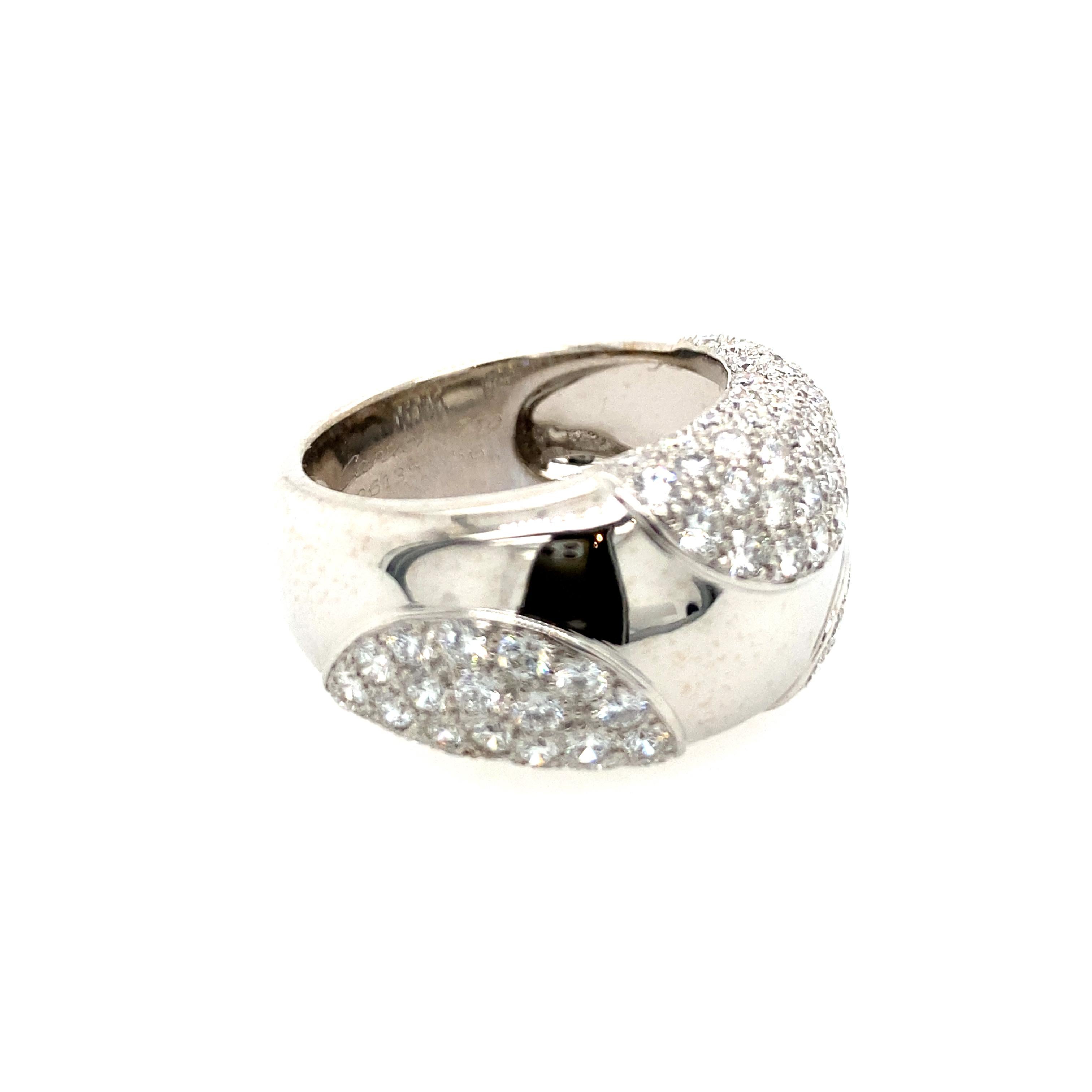 Cartier Dome Pavè Diamond Ring with a slightly tapered design of polished white gold with curved sections of pavé-set diamonds weighing approximately 1.70 carats, size 7, width 10.0 mm., mounted in 18 karat white gold, gross weight 12.4 grams,