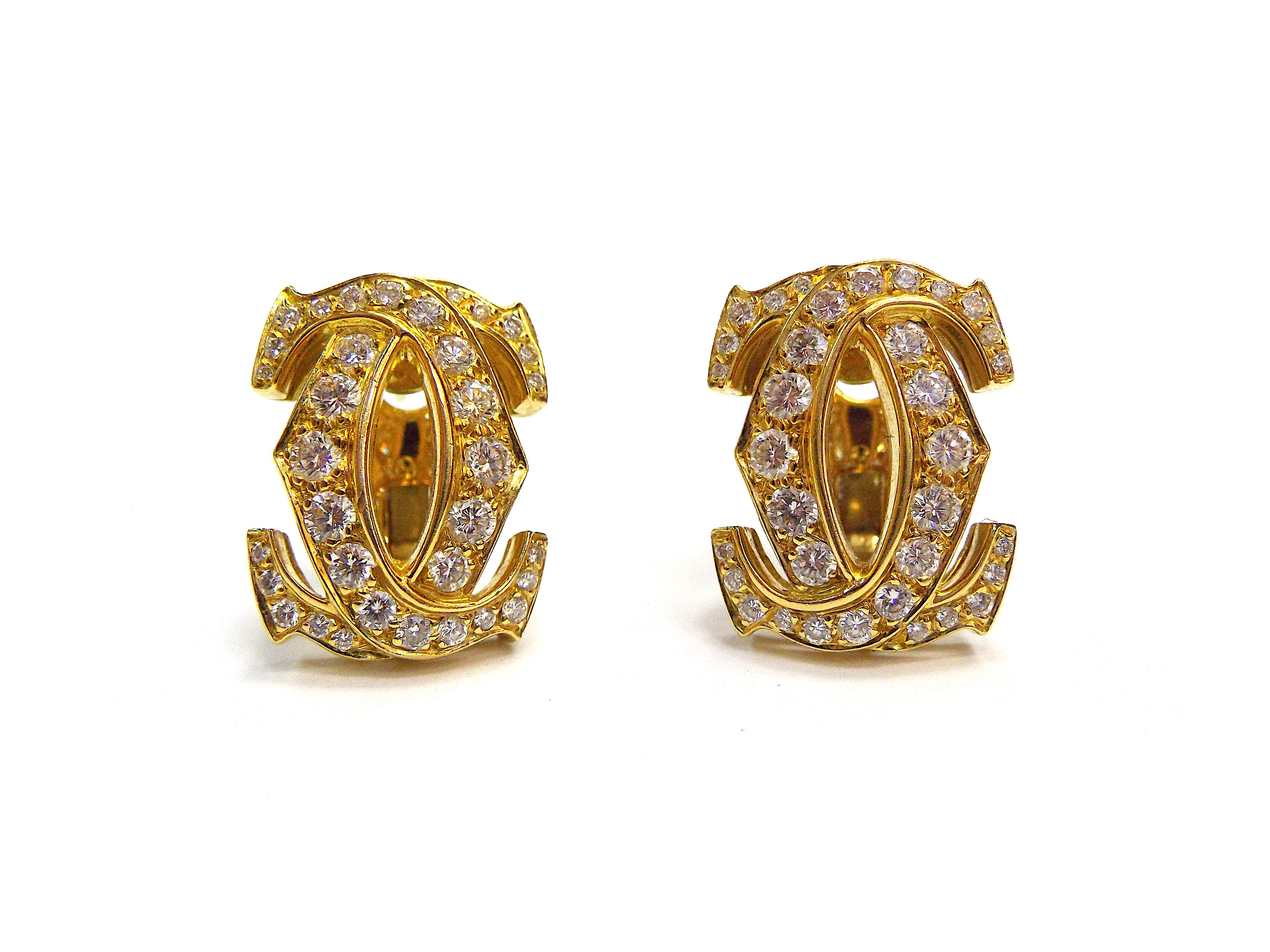 A pair of elegant earrings by Cartier from the Double C collection. Mounted in 18k yellow gold, featuring approx. 2.40 ct of diamonds. Signed Cartier, numbered, with French essay marks. The earring dimensions are 2.1cm x 1.7cm. The weight is approx.