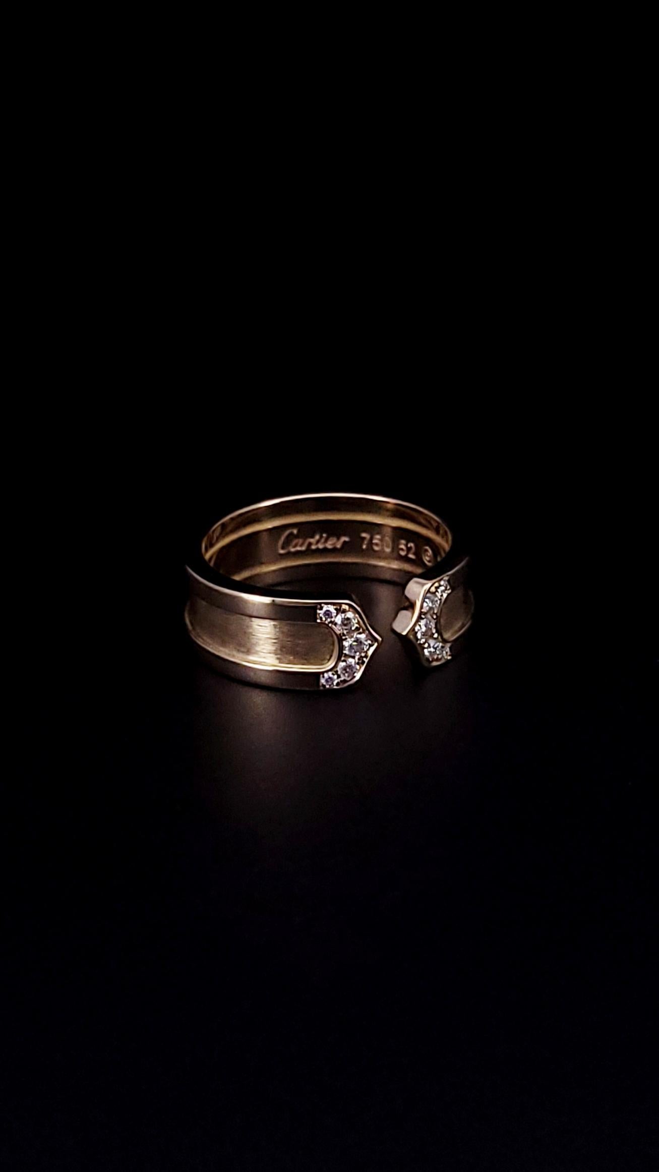 CARTIER DOUBLE C 18K GOLD DIAMOND RING

-Metal: 18k Yellow Gold
-Size: 6.25
-Thickness: 6.5mm
-Stones: Diamonds
-Weight: 7.4 Grams

Est. Retail: $4,500