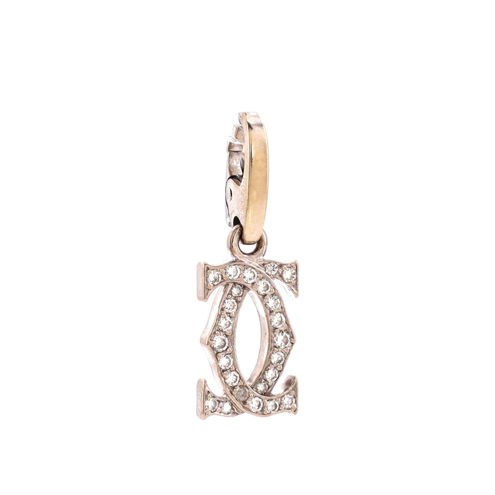 Condition: Fair. Moderately heavy wear throughout with one damaged diamond.
Accessories: No Accessories
Measurements: Height/Length: 25.50 mm, Width: 8.65 mm
Designer: Cartier
Model: Double C Charm Pendant Pendant & Charms 18K White Gold with