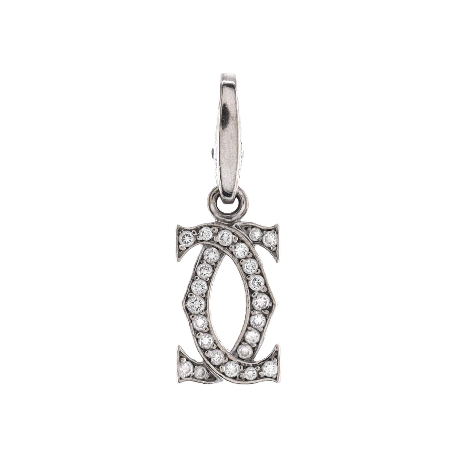 Condition: Good. Moderately heavy wear throughout.
Accessories: No Accessories
Measurements: Height/Length: 25.20 mm, Width: 8.75 mm
Designer: Cartier
Model: Double C Charm Pendant Pendant & Charms 18K White Gold with Diamonds
Exterior Color: