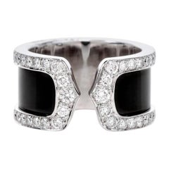 Cartier Bague à anneau ouvert double C en or 18 carats et diamants noirs