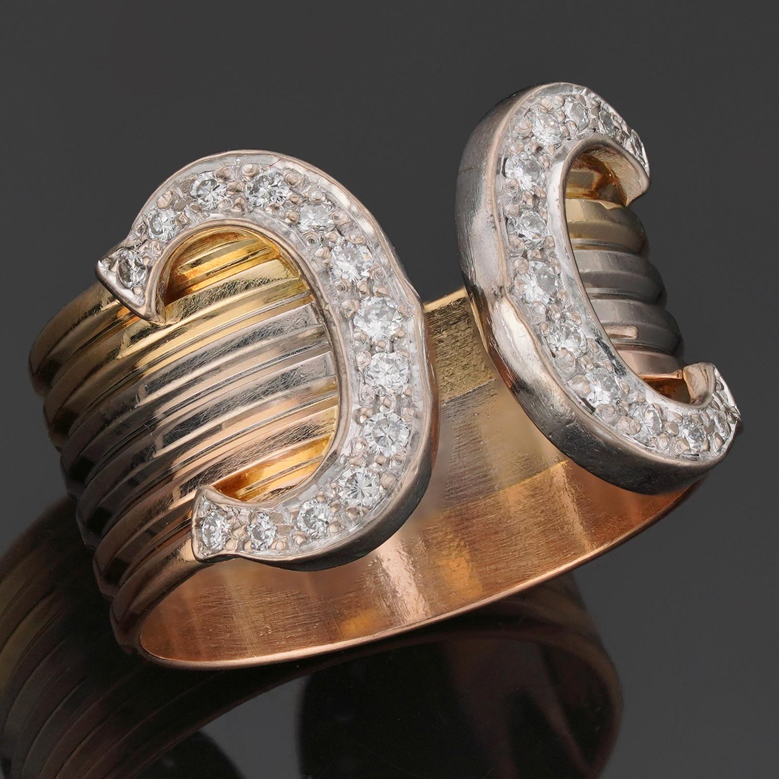 This elegant Cartier open ring features a 3-band design crafted in 18k yellow, white, and rose gold and completed with the iconic Double C ends set with brilliant-cut round diamonds. Made in France circa 1990s. The ring size slightly adjustable due