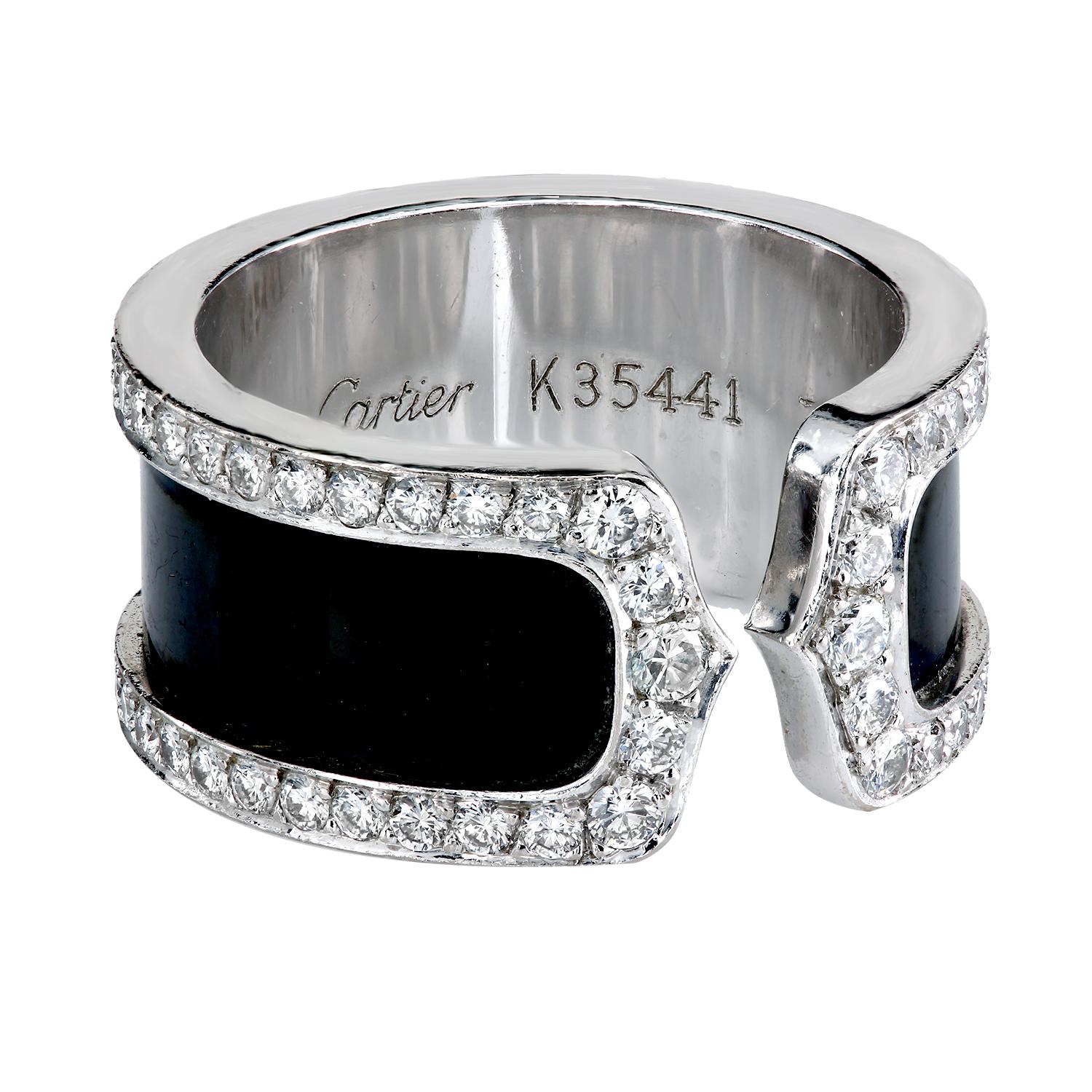 CARTIER Double C Diamond 18K Titanium/White Gold 
Crafted in solid 18K white gold, is enclosed within a frame of 80 round cut Diamond E-F color, VVS clarity, prong set.
10.0 mm width
Size Us 6 1/2; French 53
circa 2000
Serial number K35441 and