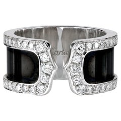 Anello Cartier "Doppia C" con diamanti e fascia nera in oro bianco 18 carati