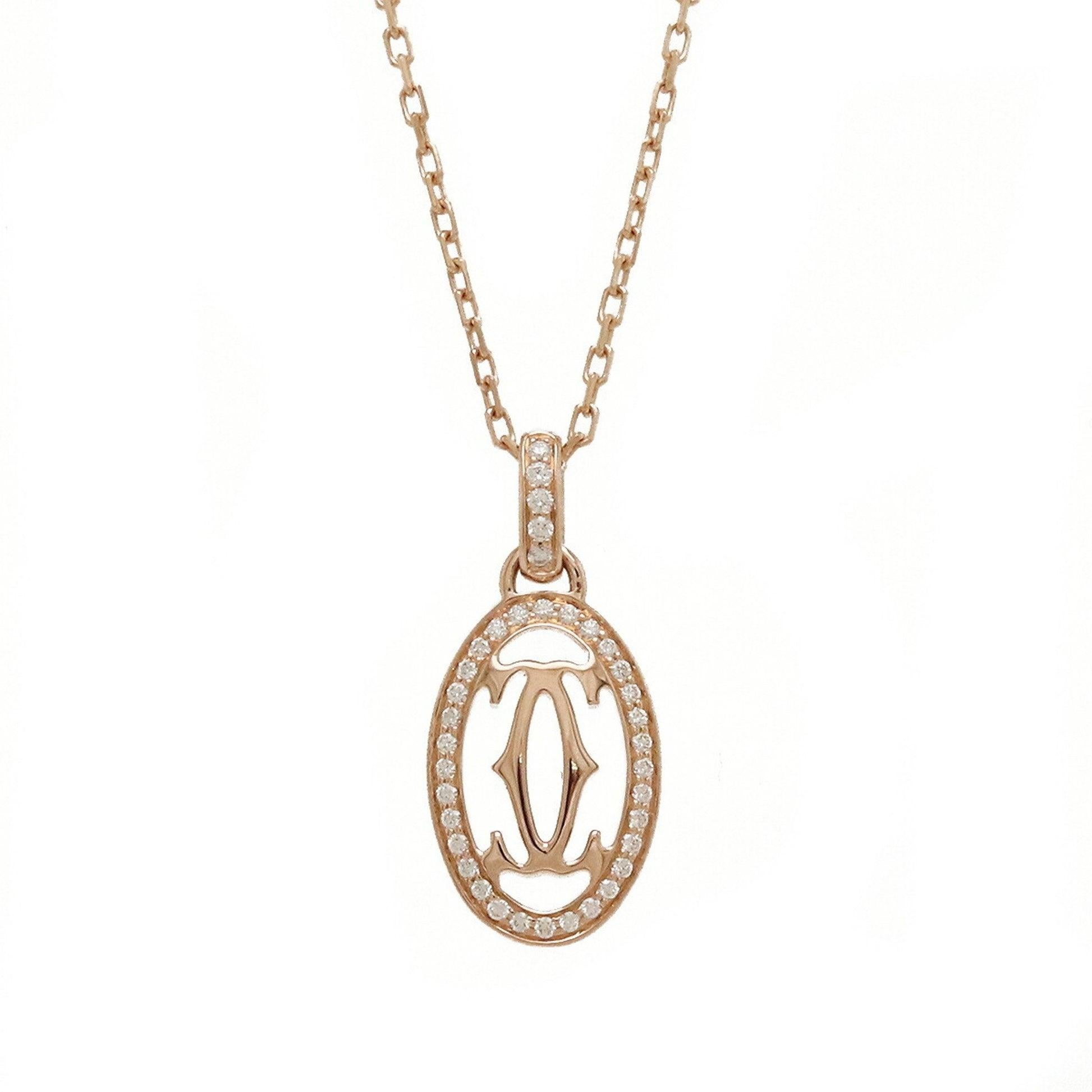 Cartier Double C Diamond Pendant Necklace in 18K Pink Gold

Additional Information:
Brand: Cartier
Gender: Women
Gemstone: Diamond
Material: Pink gold (18K)
Condition: Excellent
Condition details: The item appears unused, with little to no signs of