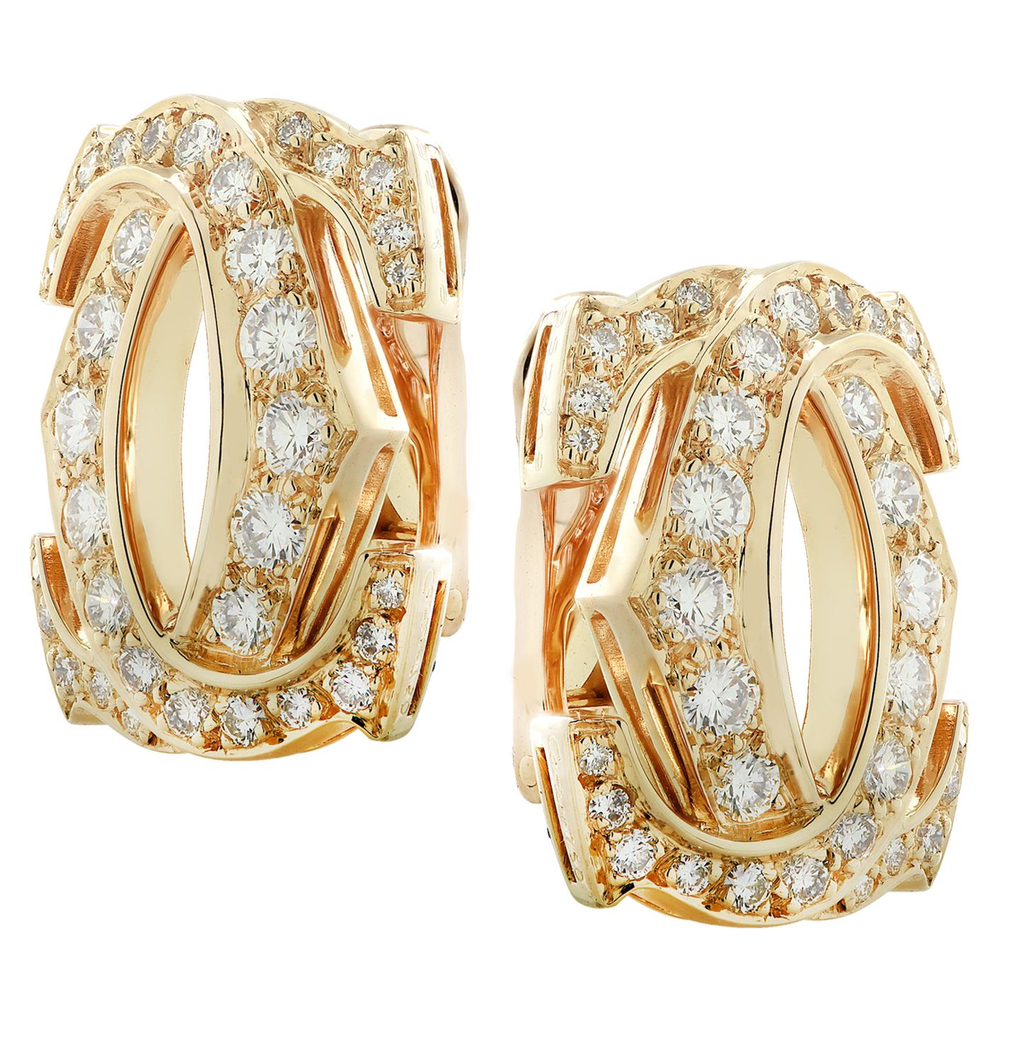From the renowned House of Cartier, these vintage Double C Diamond Stud Clip-on Earrings are finely crafted in 18 karat yellow gold, and feature 68 round brilliant cut diamonds weighing approximately 2.25 carats total, E-F color, VVS-VS clarity. Two