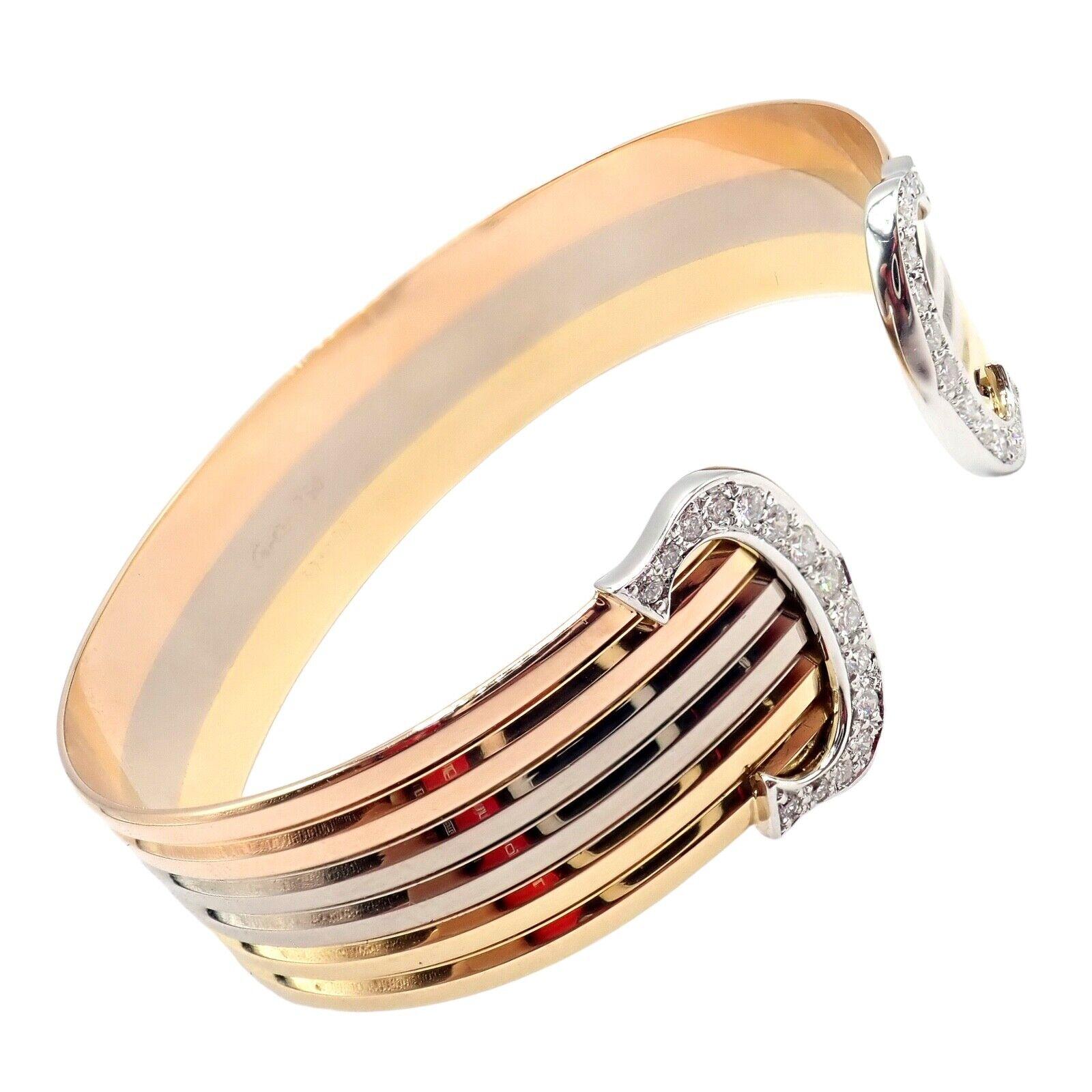18k Tri-Color Gold (Yellow, White, Rose) Diamond Double-C Bangle Cuff Bracelet by Cartier. 
With 30 round brilliant cut diamonds total weight approx .90ct. Diamonds VS1 clarity, E color
Details: 
Weight: 30.1 grams
Length: 7