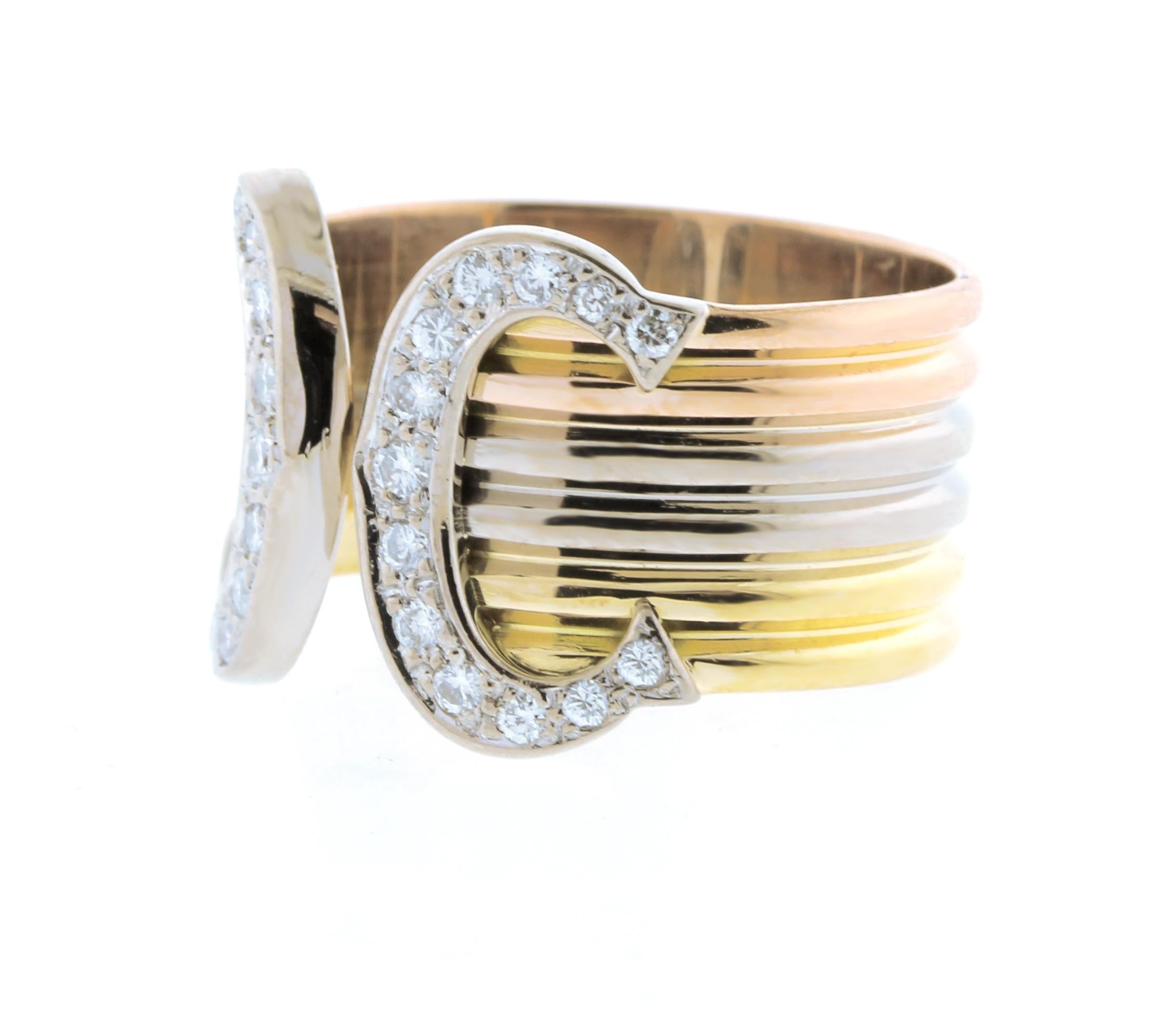 Cartier Trinity 18k diamond double C Band Ring
With 26 round brilliant cut diamonds weighing approximately .30carats
• Designer: Cartier	
• Metal: 18kt gold
•Gemstone: 26 diamonds=.30cts
• Circa: 1980s
• Size: 59, 8 3/4 can expand up to size 9, 6