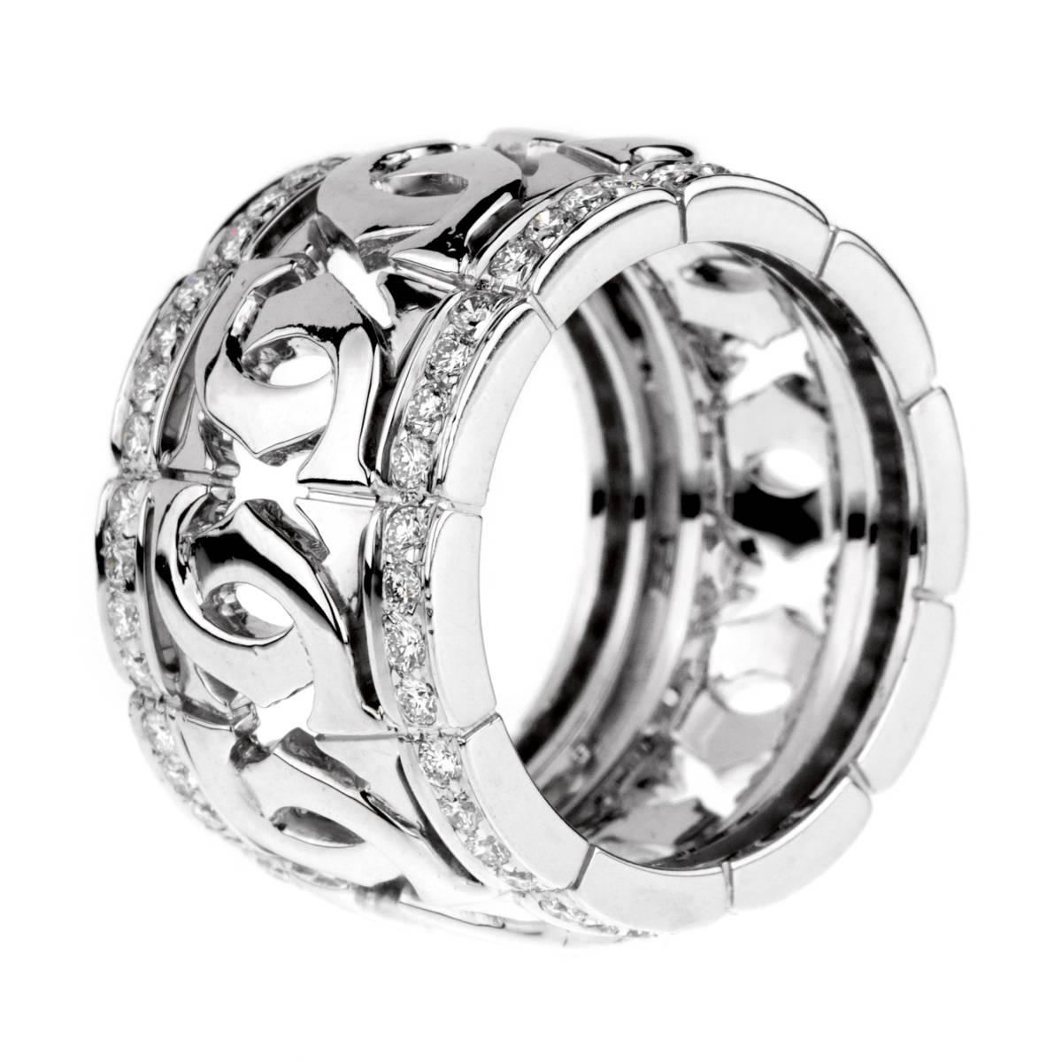 A fabulous iconic Cartier ring featuring the double c motif enhanced by 80 of the finest Cartier round brilliant cut diamonds in 18k white gold. Size 52 / US 6