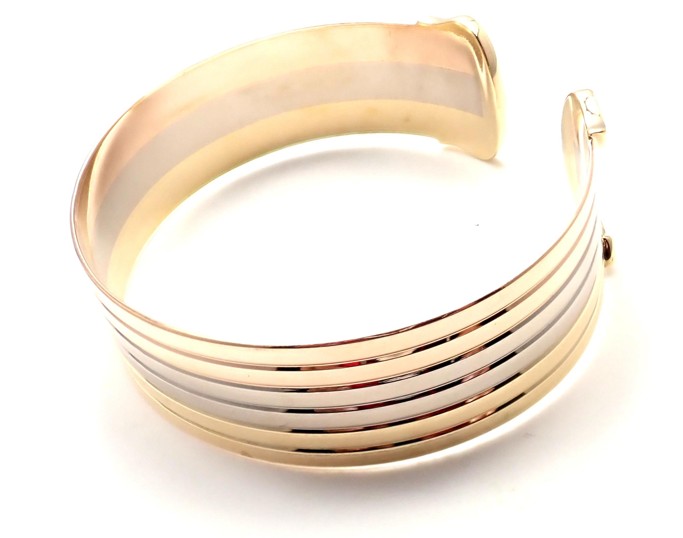 18k Tri-Color Gold (Yellow, White, Rose)  Double-C Bangle Cuff Bracelet by Cartier. 
Details: 
Weight: 32.7 grams
Length: 7
