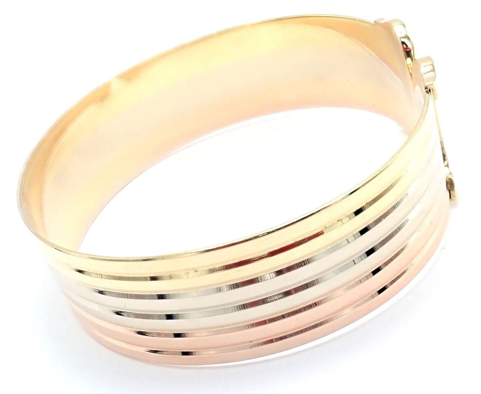 18k Tri-Color Gold (Yellow, White, Rose)  Double-C Bangle Cuff Bracelet by Cartier. 
Details: 
Weight: 34.7 grams
Length: 6 1/2