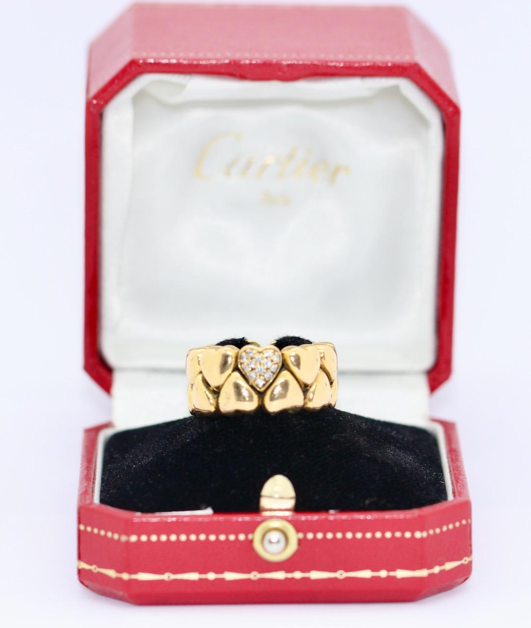 Beautiful and Rare Cartier Double Heart Coeur Ring, 18 Karat Gold with Diamonds. 

Including certificate of authenticity.

We also offer the matching earrings from the same collection.