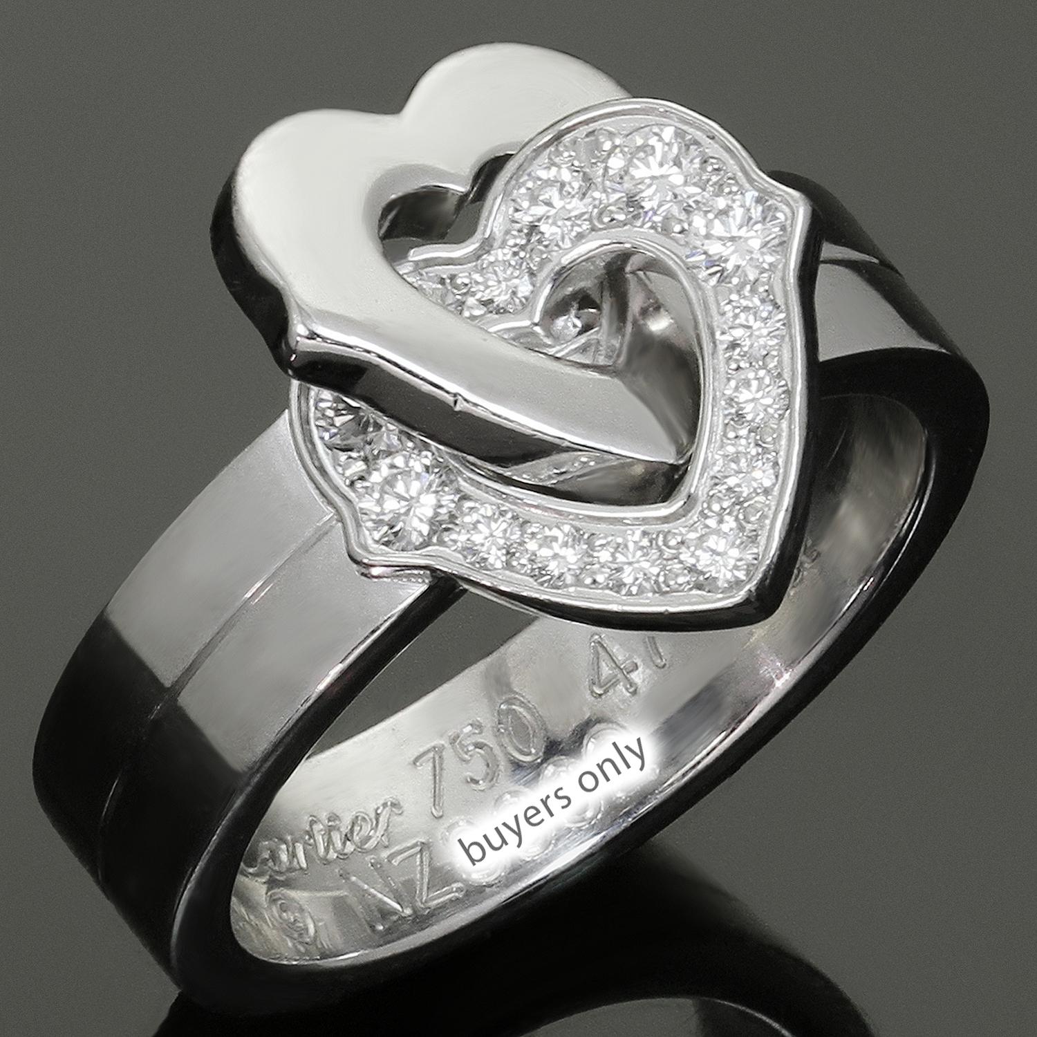 This fabulous Cartier ring features a romantic double heart design crafted in 18k white gold and set with brilliant-cut round D-F VVS1-VVS2 diamonds weighing an estimated 0.16 carats. Made in France circa 2000s. Measurements: 0.47