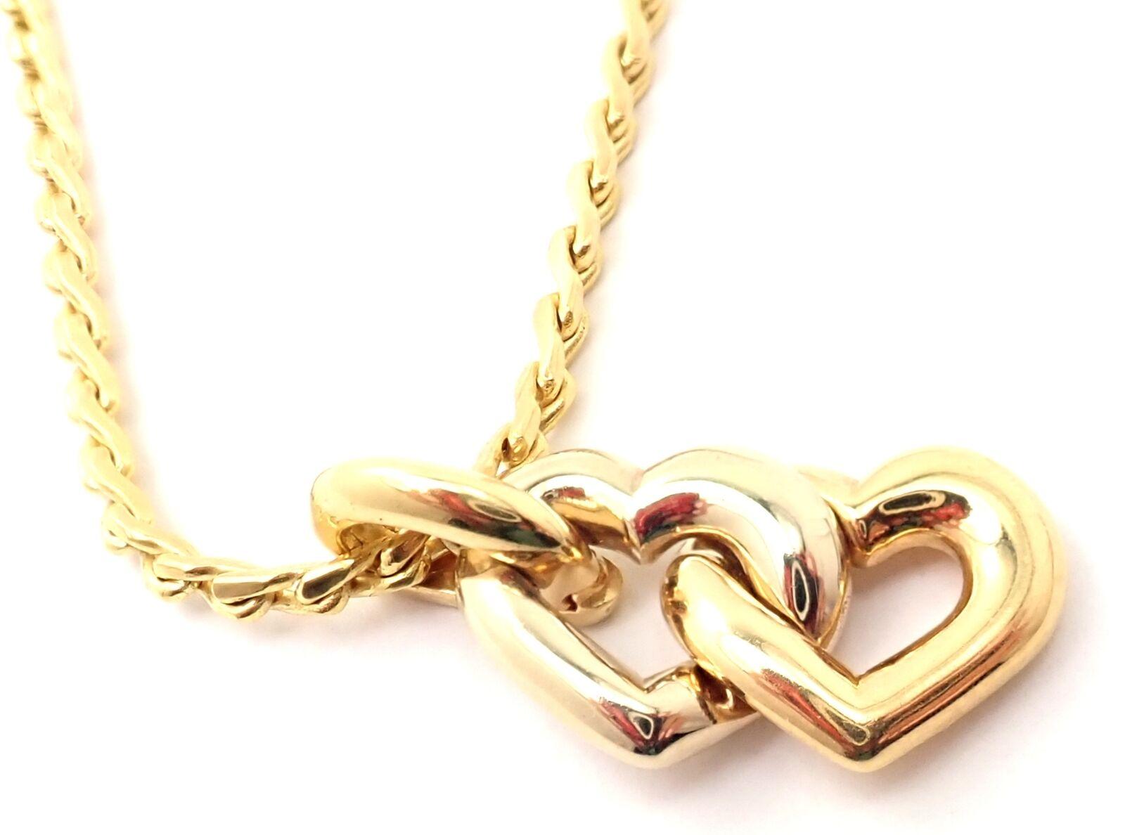 18k Yellow And White Gold Double Heart Pendant Necklace by Cartier. 
Details: 
Pendant : 29mm x 14mm
Chain: Length 19.5