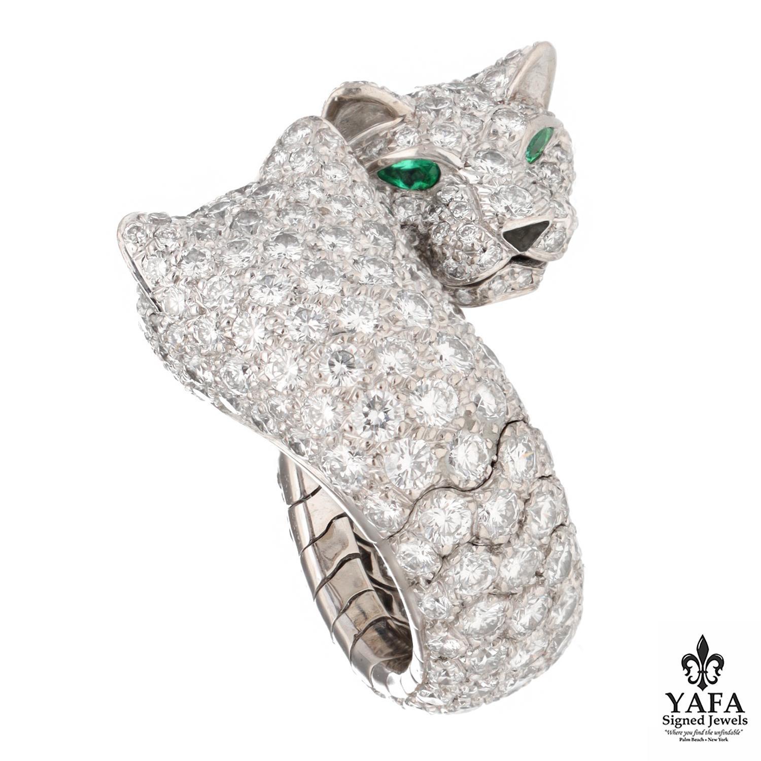 Cartier Double Panthere Lakarda 18k Gold and Diamond Ring.
Round Brilliant Cut Diamonds. Approximate Diamond Weight 8 CTS,  E Color, VVS1 Clarity.
2 emerald eyes.
2 black onyx noses.
Ring Size - 47 / 4
French Assay Marks
Signed - Cartier