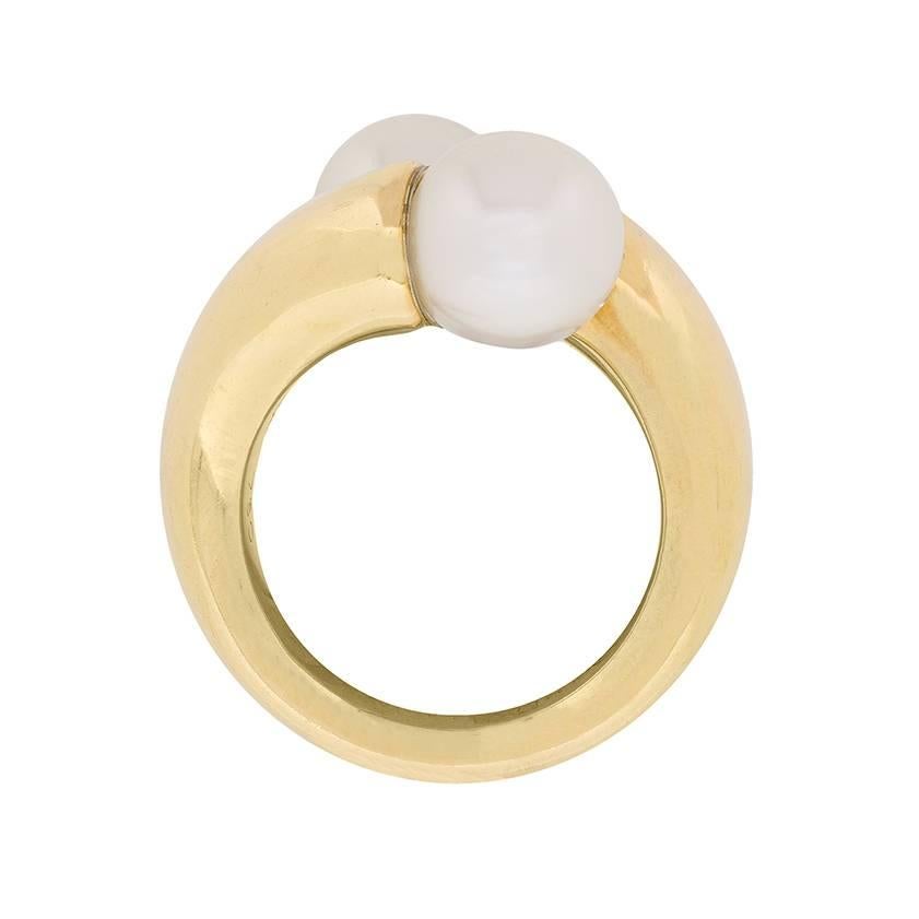This unique ring is an original Cartier piece, dating back to 1996. Although second hand, it is in excellent condition and presents as new. The pearls are 9.2mm each in size and are set alongside 18 carat yellow gold.
The piece has all original