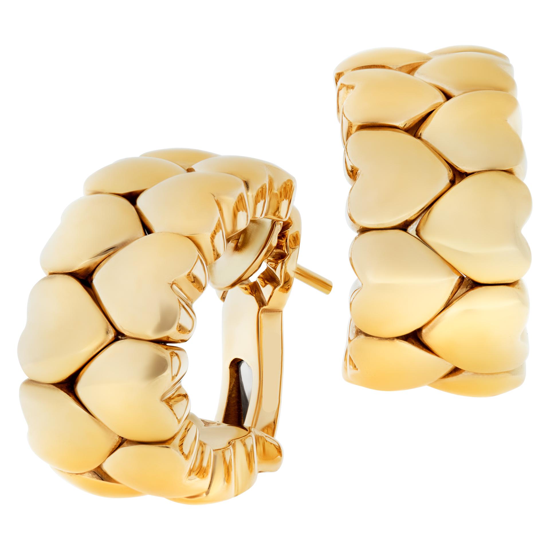 Cartier double rows of hearts, semi hoops earrings in 18k yellow gold. Post and omega clip. Length 24mm