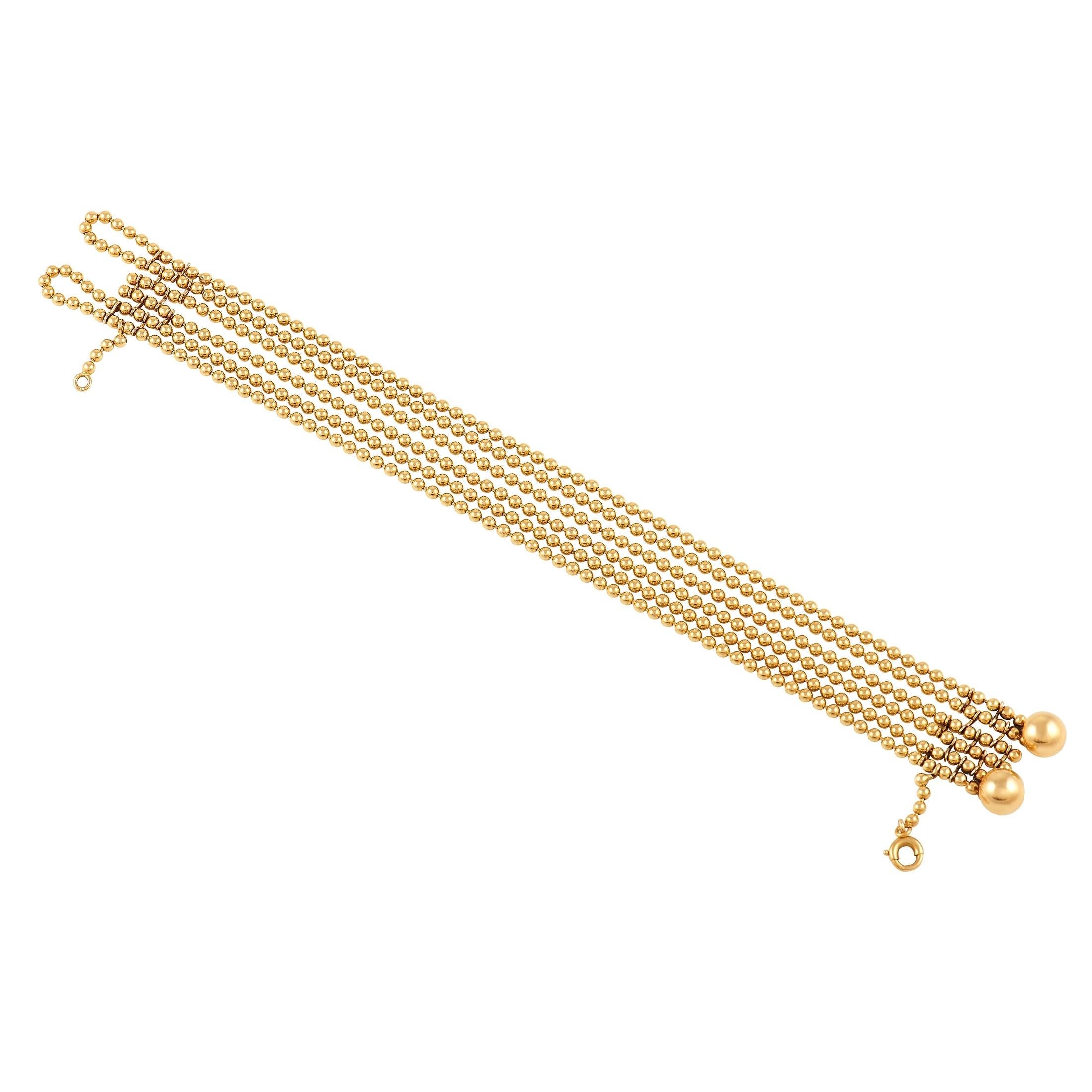 Mehrere Reihen von Perlenketten lassen dieses Armband von Cartier Draperie zart um das Handgelenk drapieren. Dieses exquisite Stück ist komplett aus glänzendem 18K Gelbgold gefertigt und misst 7