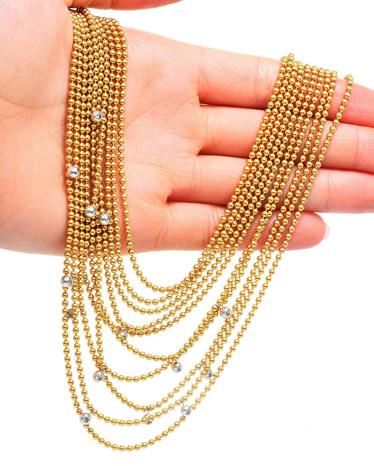 The House of Cartier presents their Collection Draperie de Décolleté circa 1930s.

This magnificent piece is crafted in solid 18K yellow gold beads, gradually presented in 10 strands of 2 mm width each.

Adding a touch of luxury, are 15 Genuine