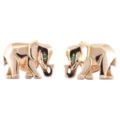 Cartier, boucles d'oreilles éléphant en or jaune 18 carats et émeraude