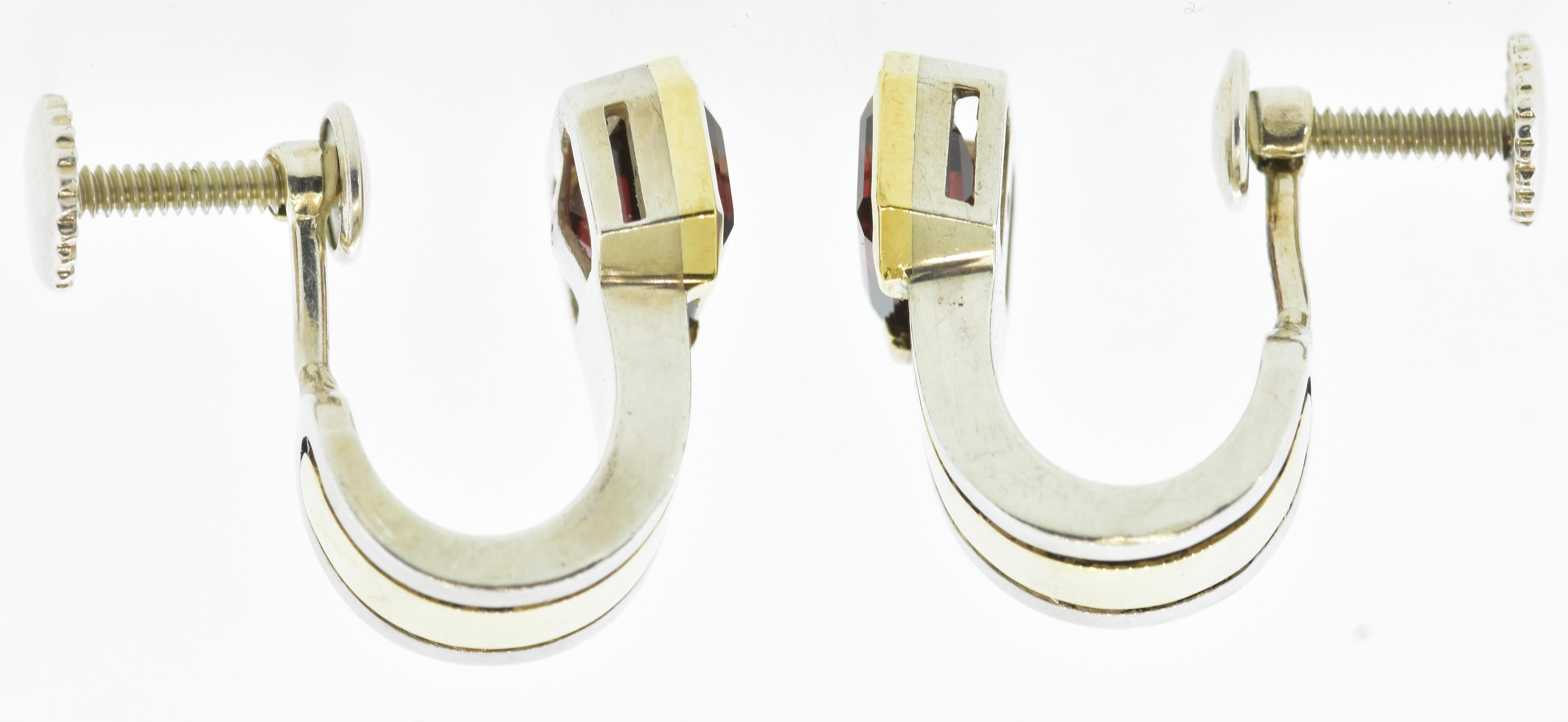 Contemporary Cartier Earrings in 18 Gold and Sterling Silver Centering Emerald Cut Garnets