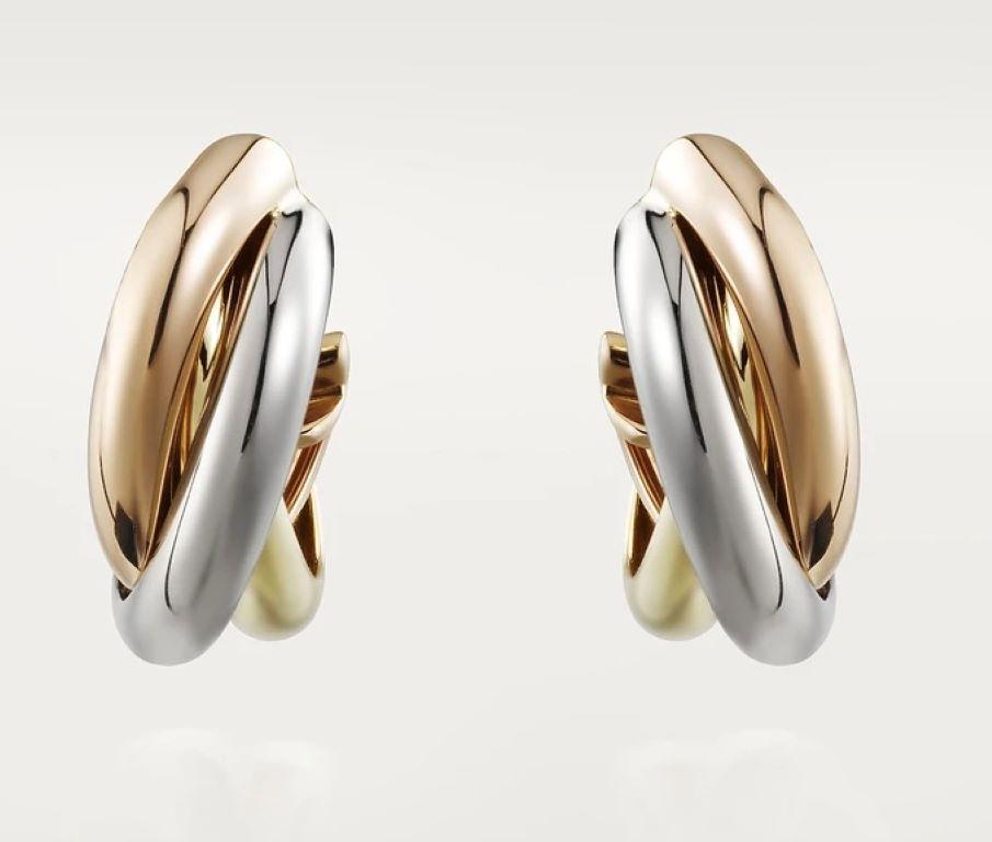 Cartier Trinity Earrings in 18 Carat Rose, White and Yellow Gold

These magnificent Cartier Trinity earrings embody the essence of refinement and elegance. With a harmonious fusion of rose gold, white gold and yellow gold, these earrings captivate