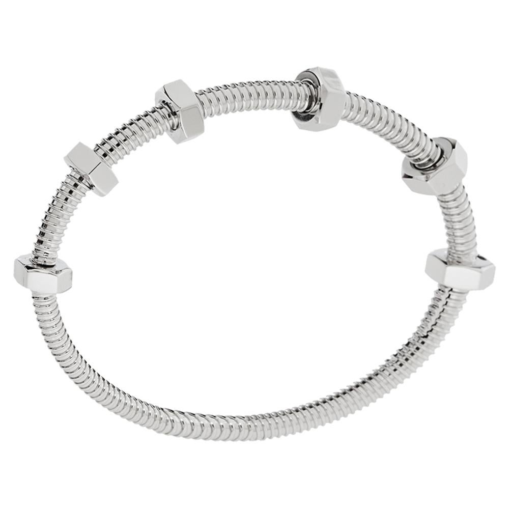 The Ecrou de Cartier bracelet from Cartier speaks of elegance and grace in a subtle way! It has been crafted from 18K white gold and designed with the iconic screw motifs on the coil detailed band. Statement-making and bold, it is Cartier's way of