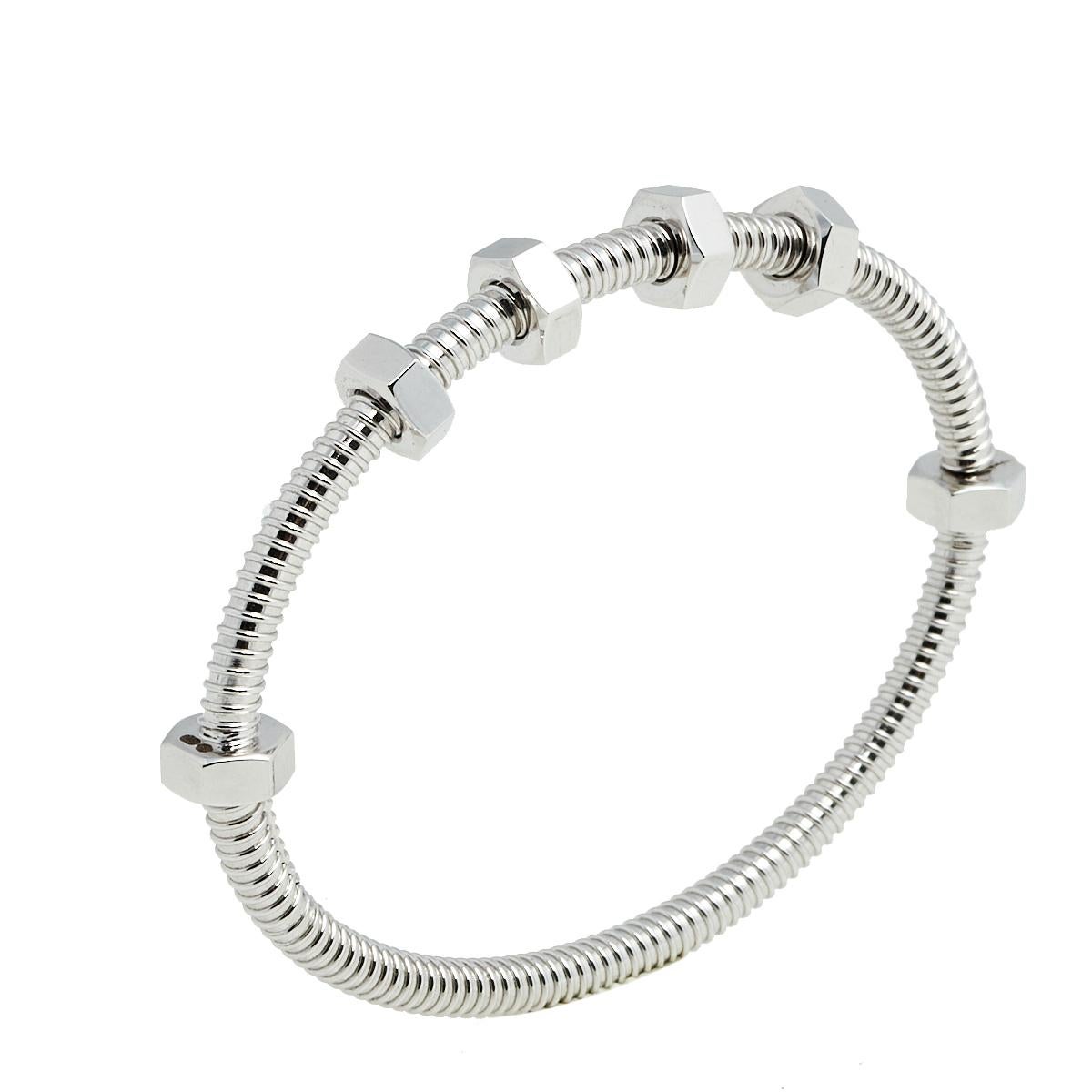 Cartier continues to explore the hardware theme with the Ecrou De Cartier line. Made from 18k white gold, this Cartier bracelet has a nut and bolt style for a statement-making look. It also offers a comfortable fit.

Includes: Original Box, Original