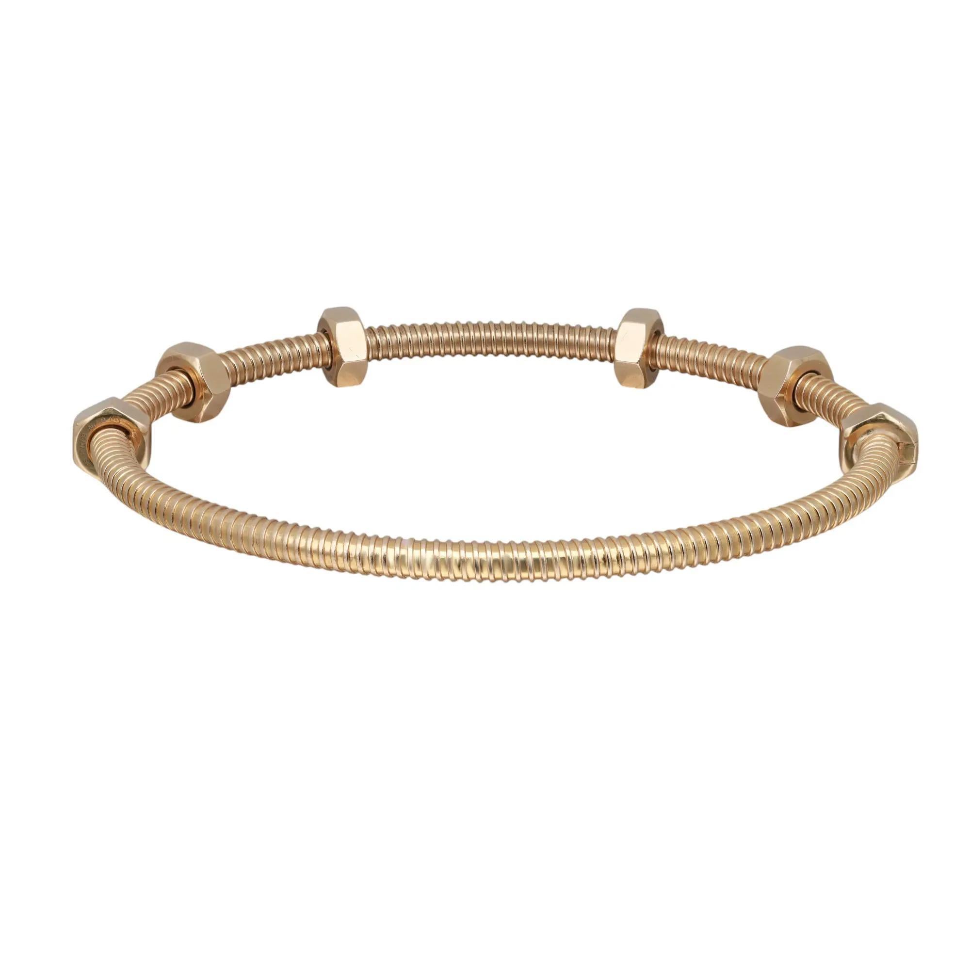 A bold new design by Cartier Écrou de Cartier bracelet collection. Crafted in 18K Yellow gold. Size 18. Width: 3.5 mm. Total weight: 29.71. Excellent pre-owned condition. Comes with an original Cartier box and papers. 