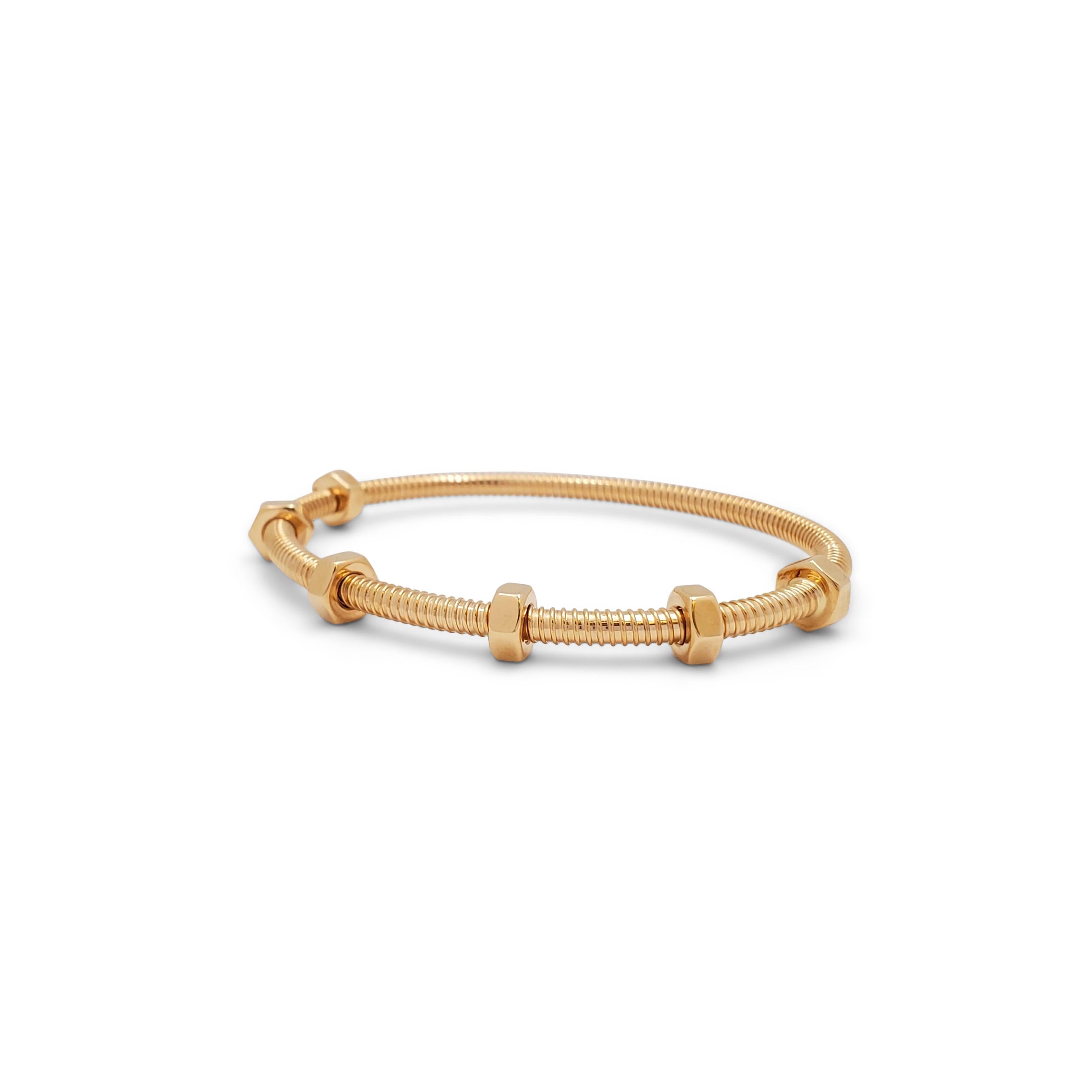 Authentic Cartier 'Ecrou de Cartier' bracelet crafted in 18 karat rose gold. The bracelet features a daring new industrial 'nuts and bolts' design. 'Ecrou' being the French word for 'nut'. Size 17.  Signed Cartier, 17, 750, with serial number and