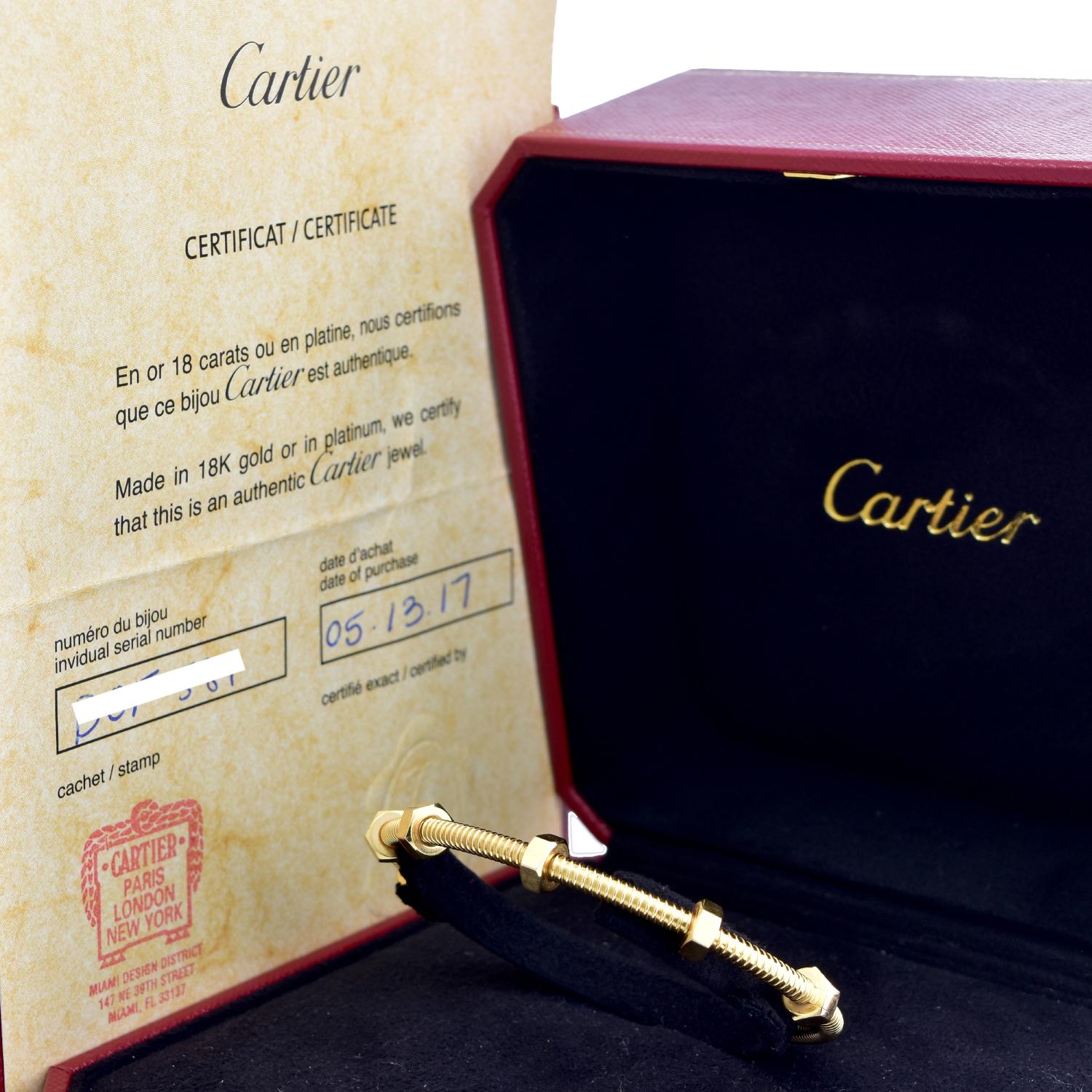 Designer: Cartier

Collection: Ecrou

Style: Bracelet/ Bangle

Metal: Yellow Gold

Metal Purity: 18k

Total Item  Weight ( Grams) : 29.5

Bracelet Size : 18 = 18 Cm

Bracelet Width: 3.5 mm

Hallmarks: Cartier; Serial #; 750

Includes:  24 Months