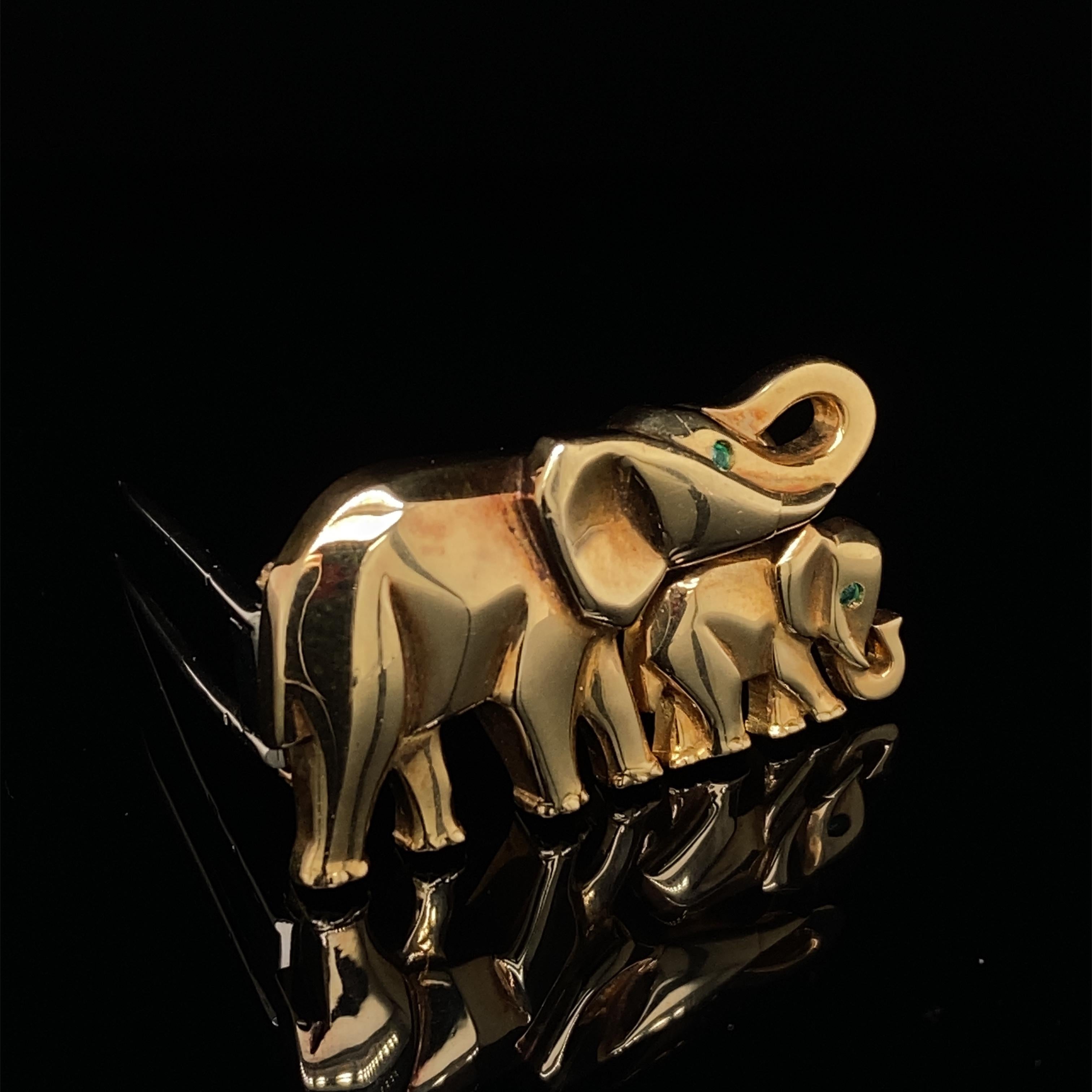 A Cartier elephant and calf emerald set brooch in 18 karat yellow gold.

A fun elephant brooch in 18 karat yellow gold by Cartier, this is a must have for all elephant and indeed animal lovers!

This charming brooch is realistically modeled in