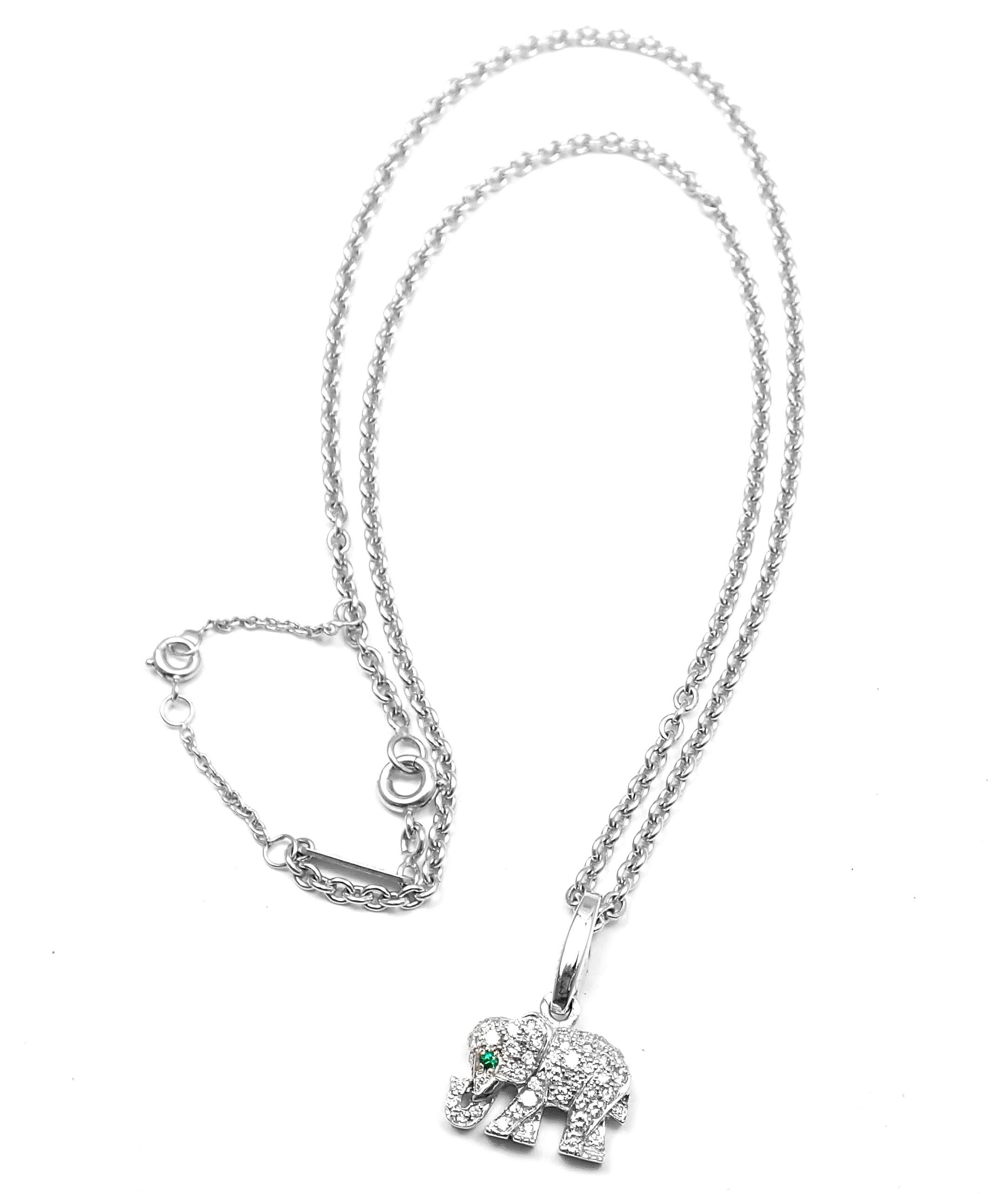 18k White Gold Diamond & Emerald Elephant Pendant Necklace by Cartier. 
With round brilliant cut diamonds, VS1 clarity, G color. Total Diamond Weight: .60ct. One round emerald stone. 
Details: 
Chain Length: 16.5