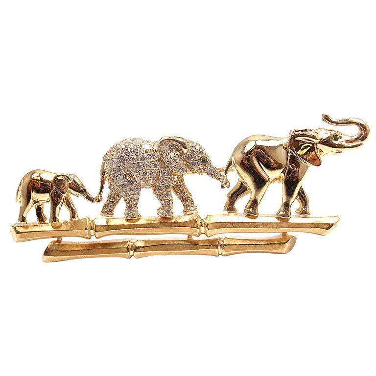 Cartier Elephant Family brooch in 18kt yellow gold with diamonds and three emerald “eyes.”