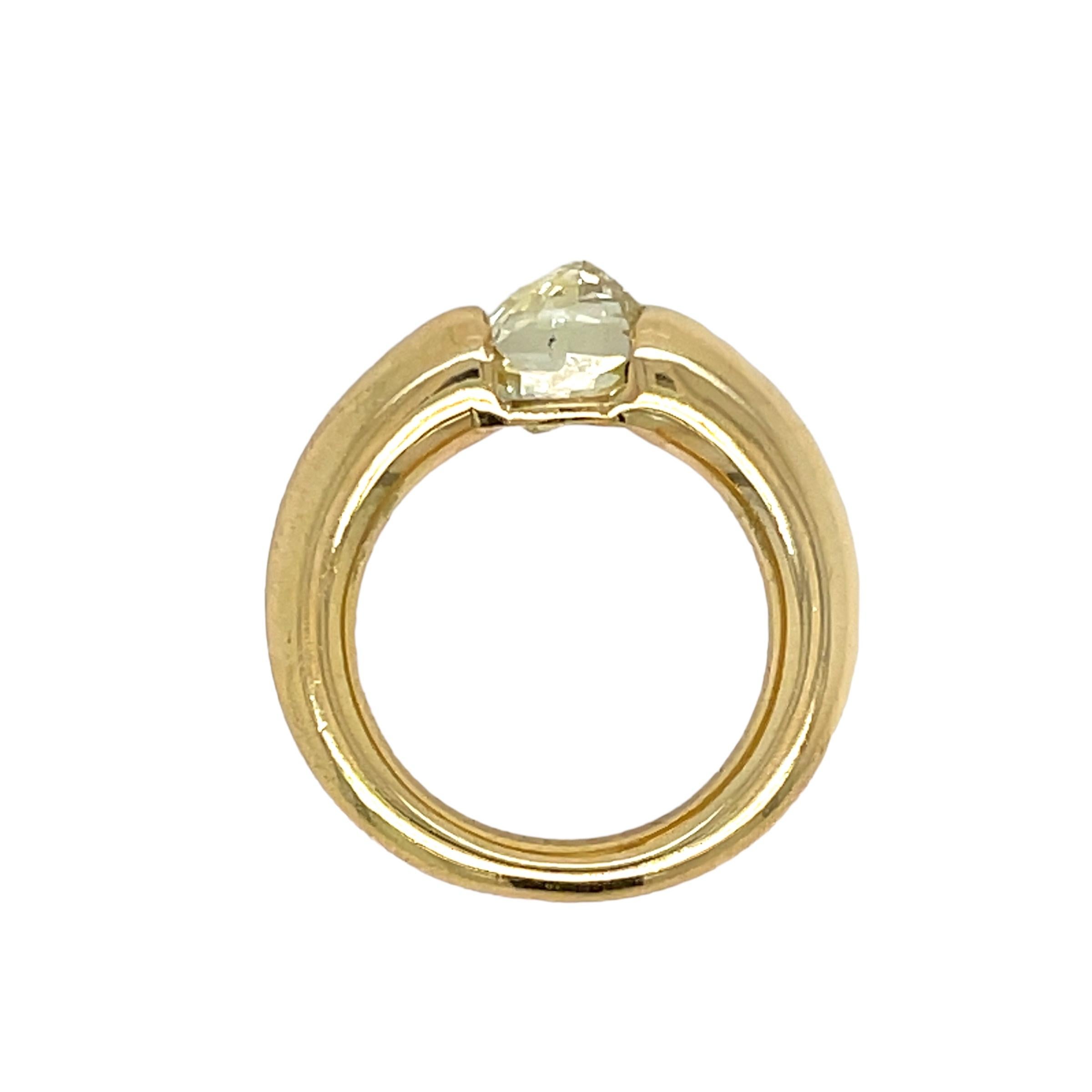 Contemporary and nice Band Ring from Timeless Ellipse Collection.

This Cartier ring is fully made in 18 k yellow gold. It features 1 Briolette cut Light Fancy Yellow Diamond whose weight is 1,65 ct. approx.
Stamped Cartier, with the maker's mark,