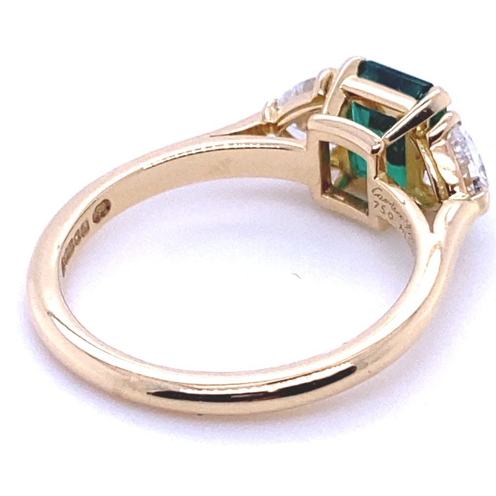 Modern Cartier Emerald and Diamond Three Stone 18 Karat Yellow Gold Ring