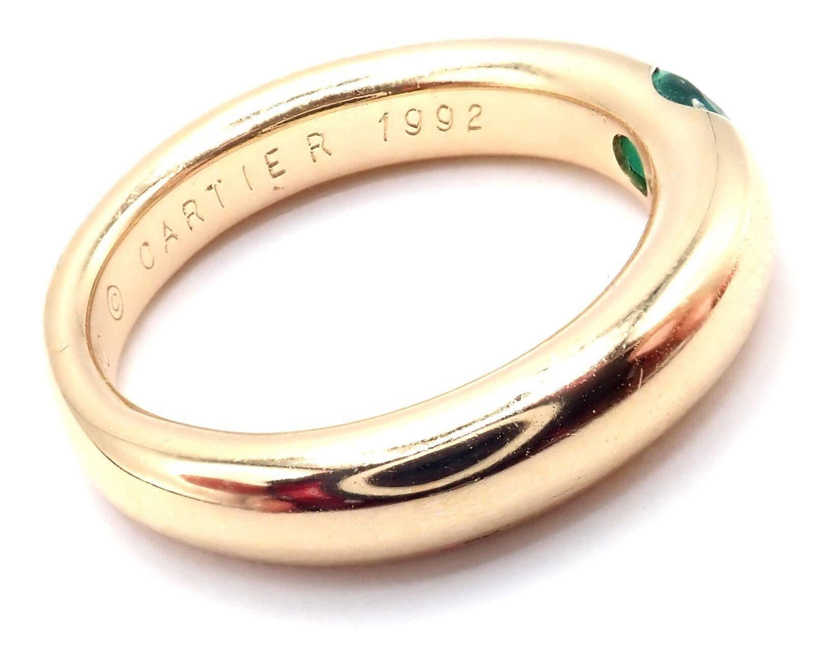 18k Yellow Gold Ellipse Emerald Band Ring by Cartier.
With 1 oval-shaped beautiful emerald 5mm x 4mm.
Details:
Width: 4mm
Weight: 9.5 grams
Ring Size: European 55, US 7 1/4
Stamped Hallmarks: Cartier 750 55 C 1992 921XX(serial number omitted)
*Free