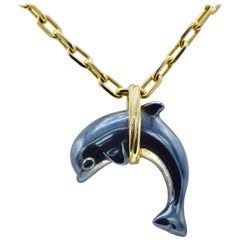 Cartier Emerald, Gold, and Blackened Silver 'Dolphin' Pendant Necklace