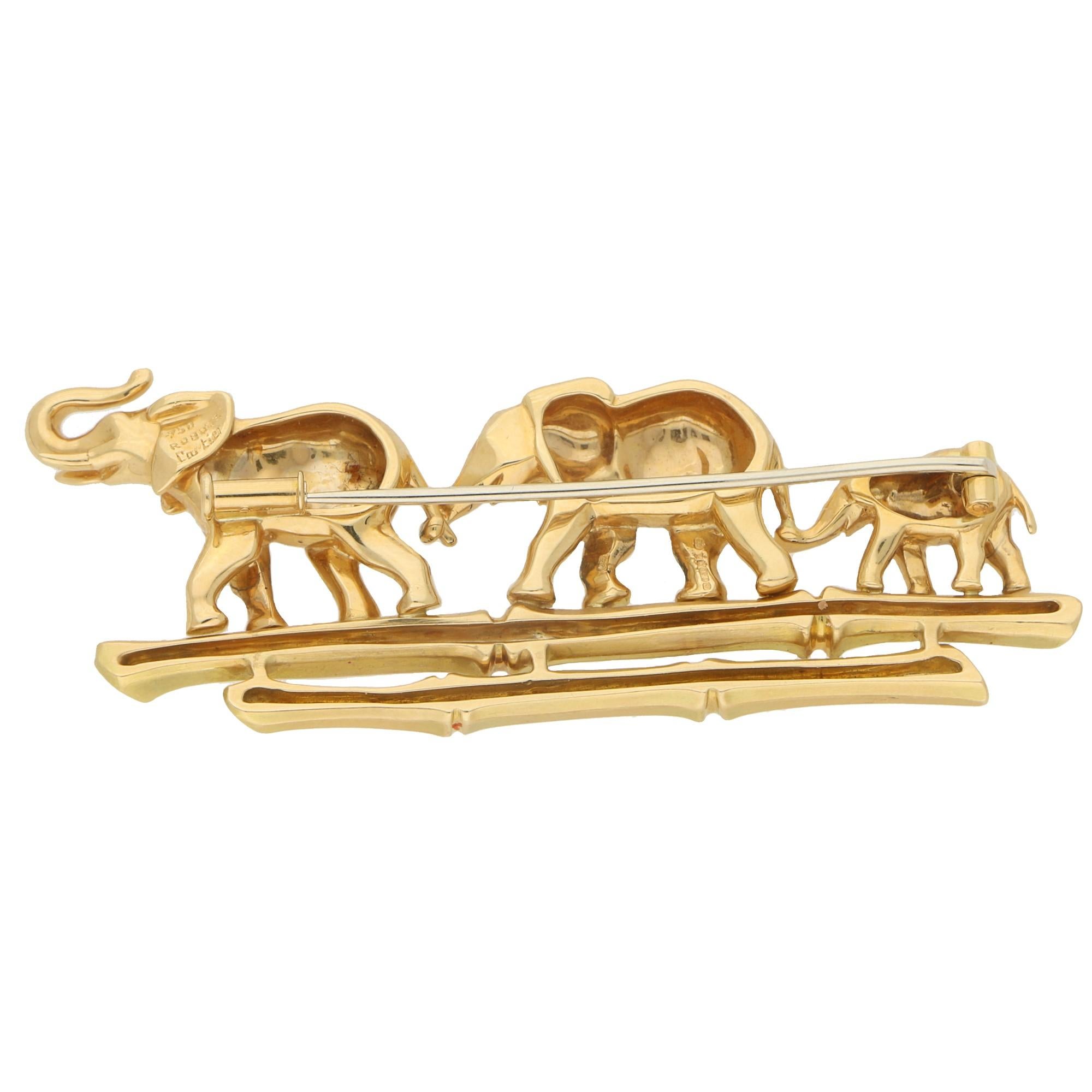 A beautiful family of walking elephant's brooch set in 18k yellow gold, signed Cartier. This spectacular piece is called the 'Tsavo' brooch from the 'Route des Indes' collection which was a popular vintage collection in the late 1990's. 

The brooch
