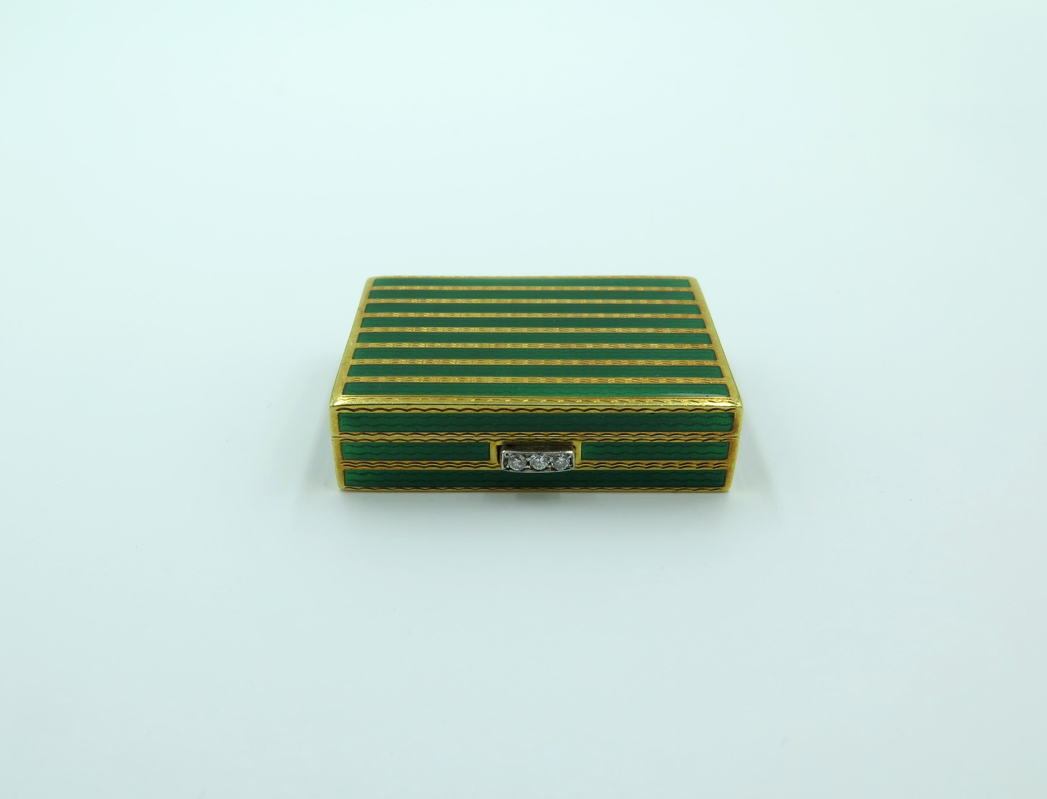An 18 karat yellow gold, enamel and diamond box. Cartier. Circa 1960. Of rectangular outline, decorated by green guilloché  enamel stripes, enhanced by circular cut diamond push piece. The box measures approximately 1 3/8 x 1 inches, gross weight is