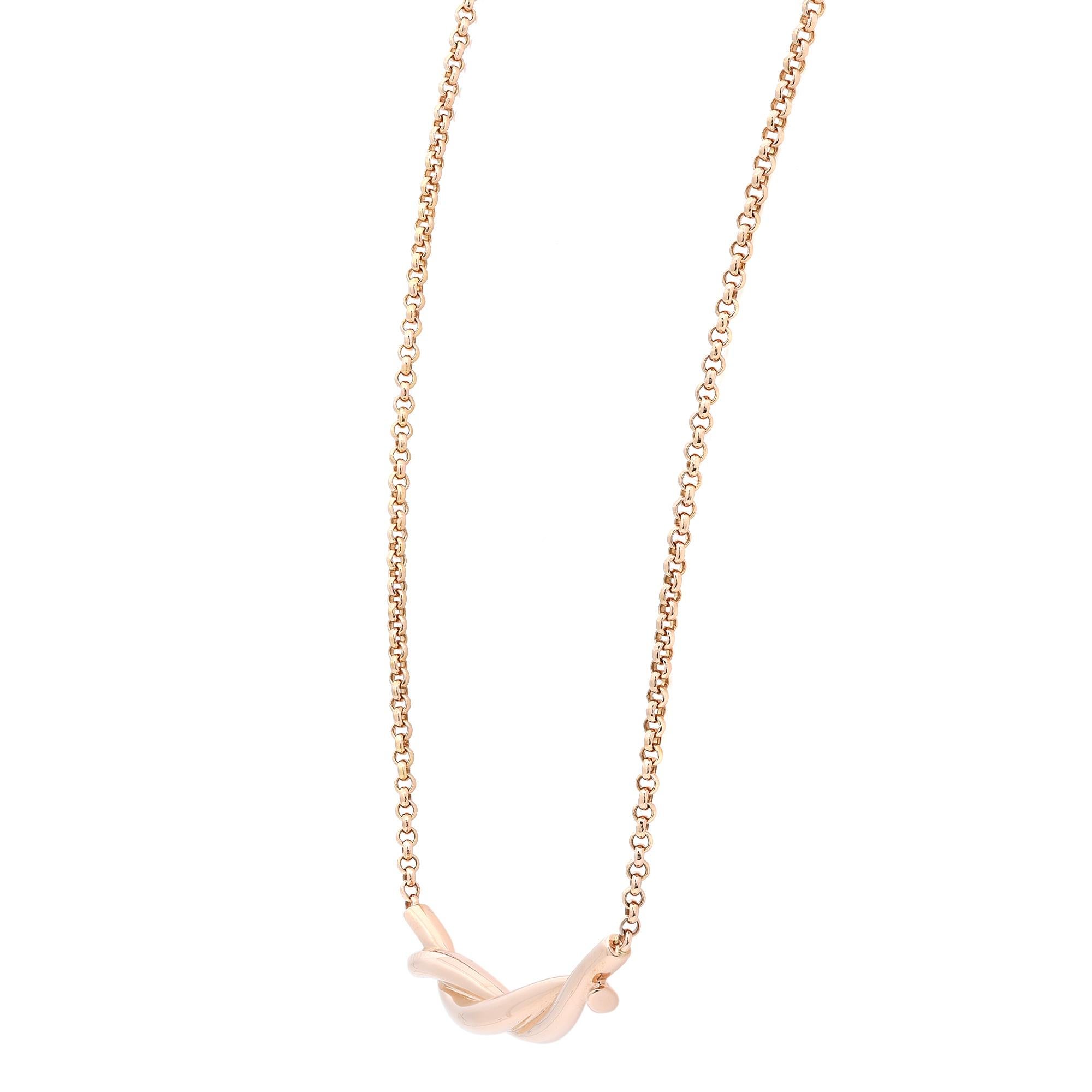 This elegant Cartier Entrelaces chain necklace features two slim bars gently twisted together like an unbreakable bond. Crafted in fine 18k rose gold. Chain length: 16 inches. Total weight: 7.50 grams. Excellent pre-owned condition. Comes with an