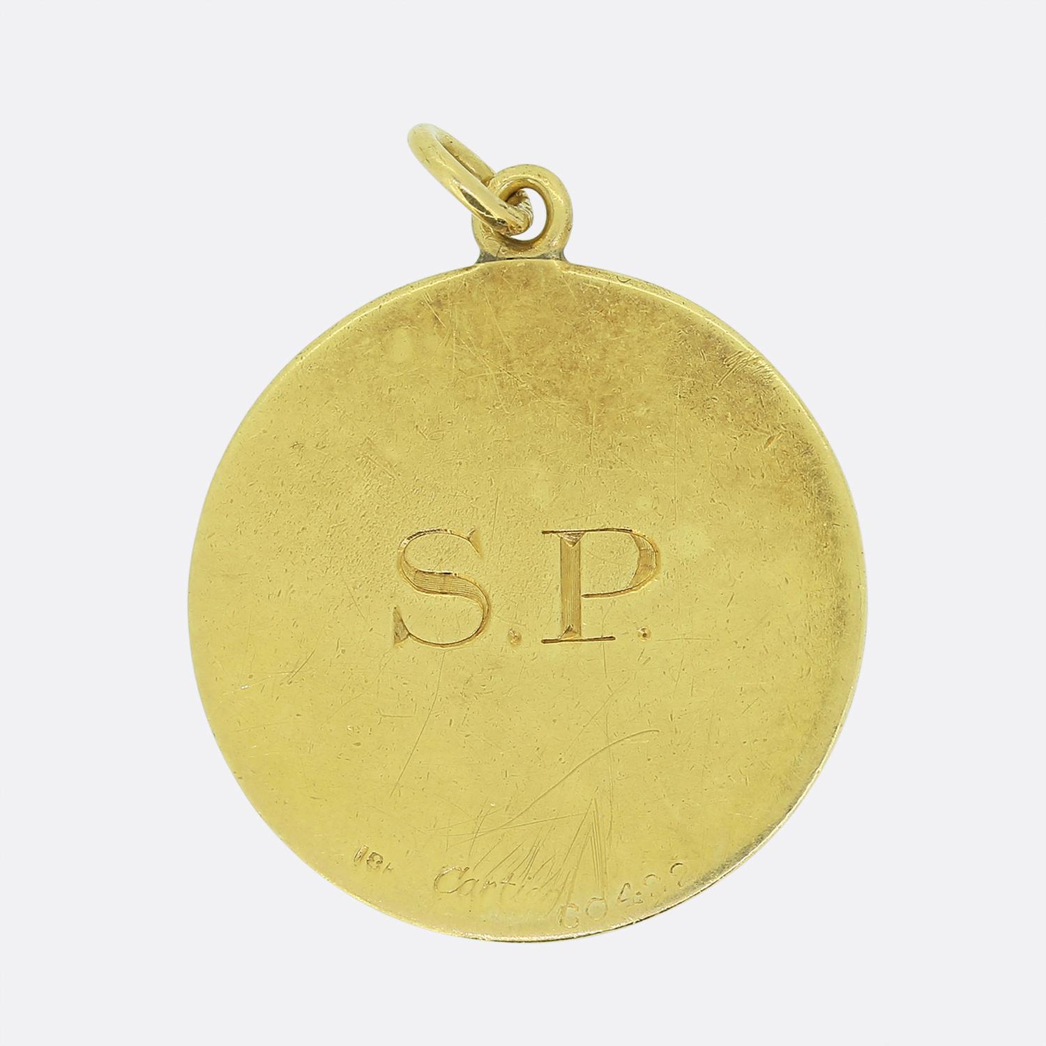 Here we have a wonderful piece of history taken from Eric Clapton's summer tour of 1975. This 18ct yellow gold pendant disc was commissioned to Cartier and is engraved with the words 'Eric Clapton, Summer Tour '75' with a guitar and palm tree motif