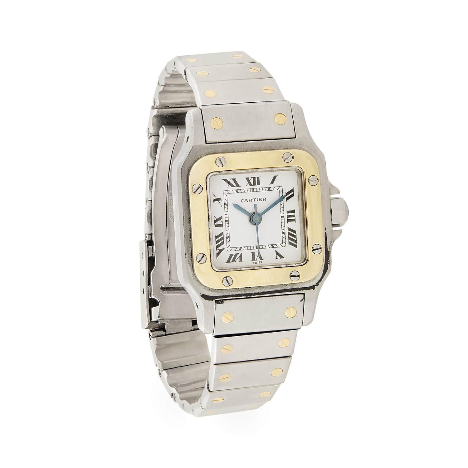 This sleek and stylish estate watch is a signed Cartier timepiece! The Swiss made watch, which is part of the Santos has a stainless steel design with a square-shaped face and industrial band. A smooth gold bezel, which is secured to the case with