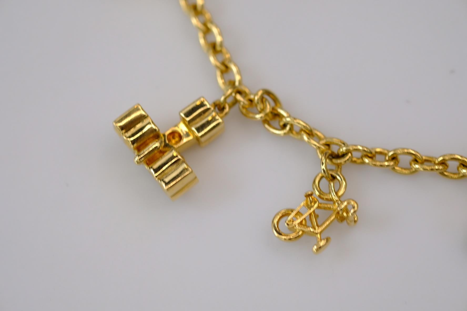 Cartier Estate 18K Gelbgold 7 Charm Merry-Go-Round-Armband 7