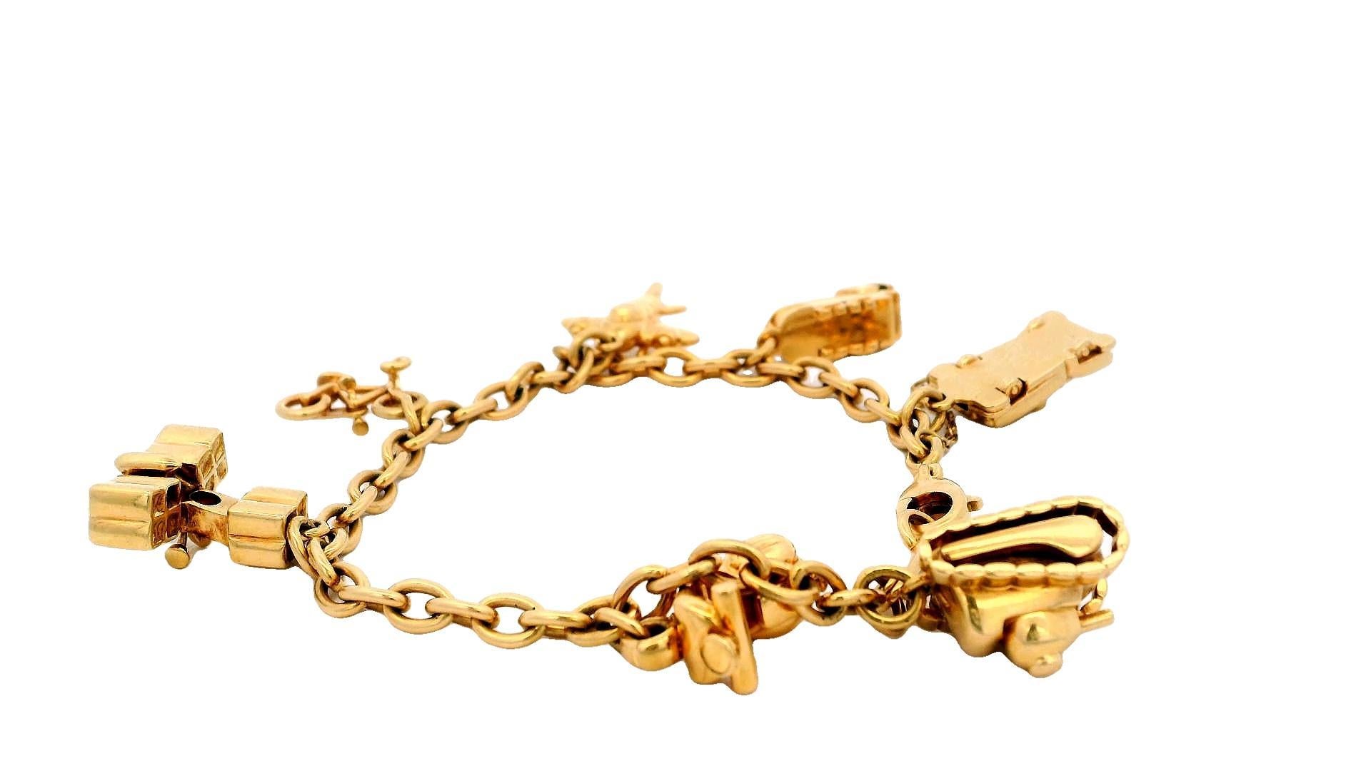 Cartier Estate 18K Yellow Gold 7 Charm Merry-Go-Round Bracelet In Excellent Condition For Sale In Great Neck Plaza, NY