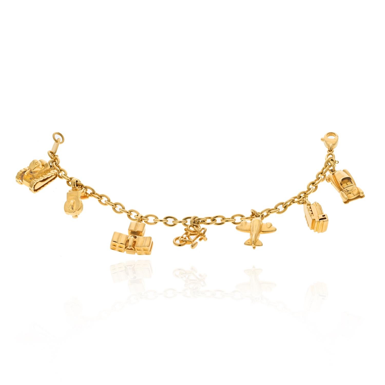 Modern Cartier Estate 18K Yellow Gold 7 Charm Merry-Go-Round Bracelet For Sale