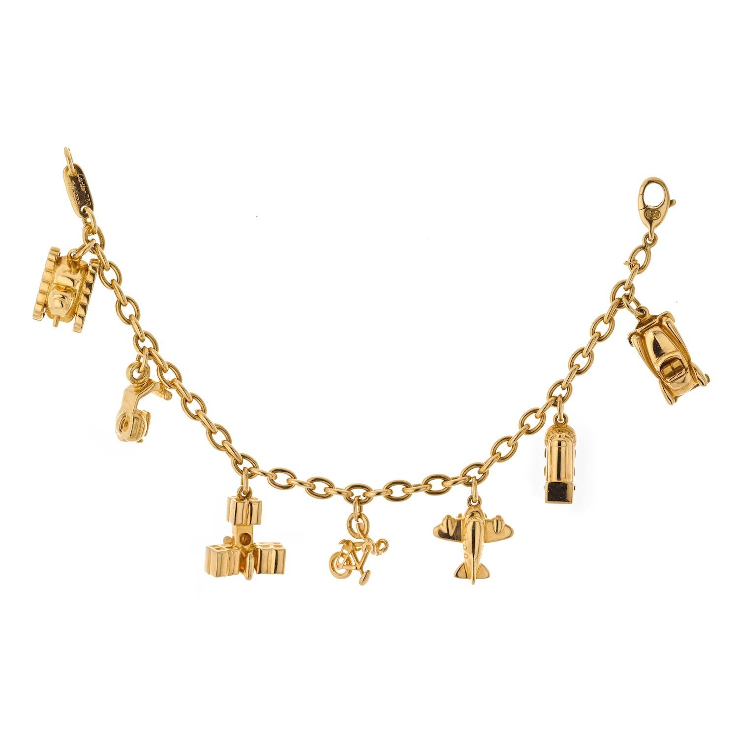 Cartier Estate 18K Yellow Gold 7 Charm Merry-Go-Round Bracelet In Excellent Condition For Sale In New York, NY