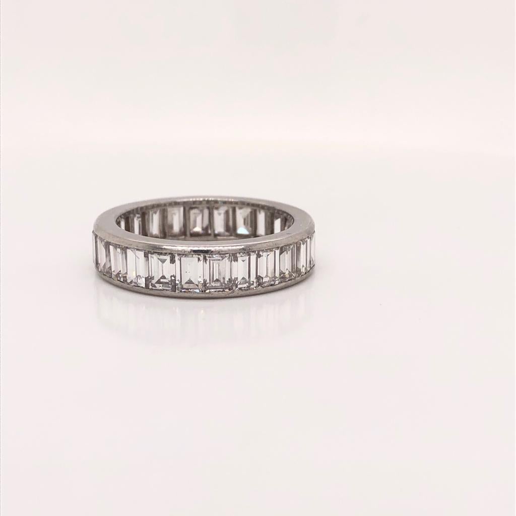 Cartier eternity diamond band made in platinum weighting 5.5g 
Diamond Weight: 6.5ct 
Shape/Cut: Emerald (26 stones, 0.25ct each)
Color: F
Clarity: VVS
Size: 7.25 / 7.5 
We offer Appraisals by The National Association of Jewelry Appraisals.
We